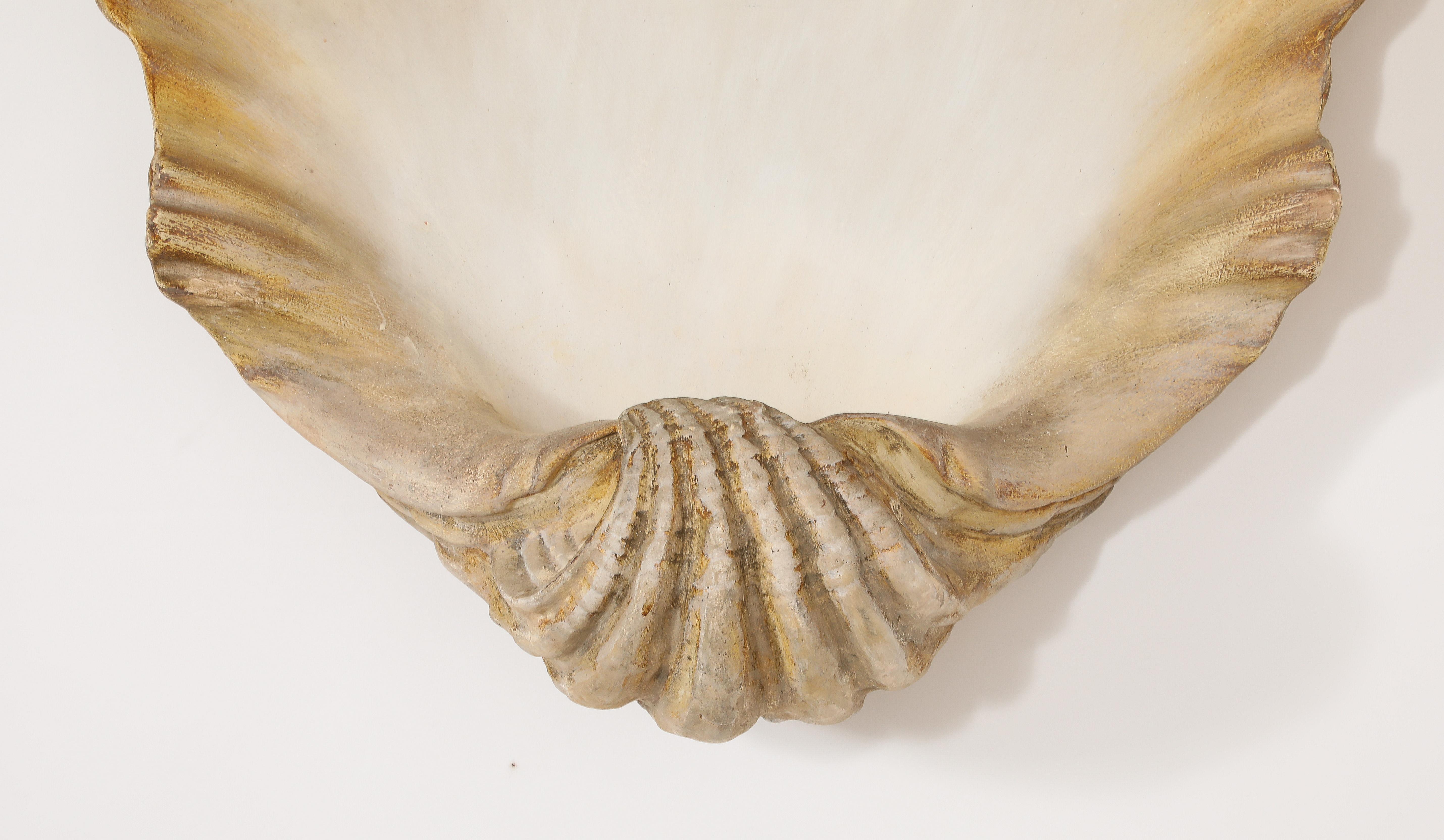 Very dramatic and large Plaster shell with a wonderful patina. Can be a wall decor or a sconce as there is a provision for wiring.