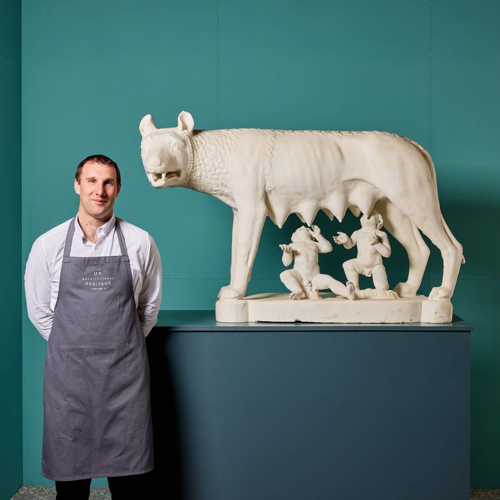 A large-scale plaster statue of the Capitoline Wolf circa 1900 after the antique in bronze thought to date from as early as the 11th century. Originally made by the Moulage Museum, Brussels, this plaster statue was sourced from a huge stately home.