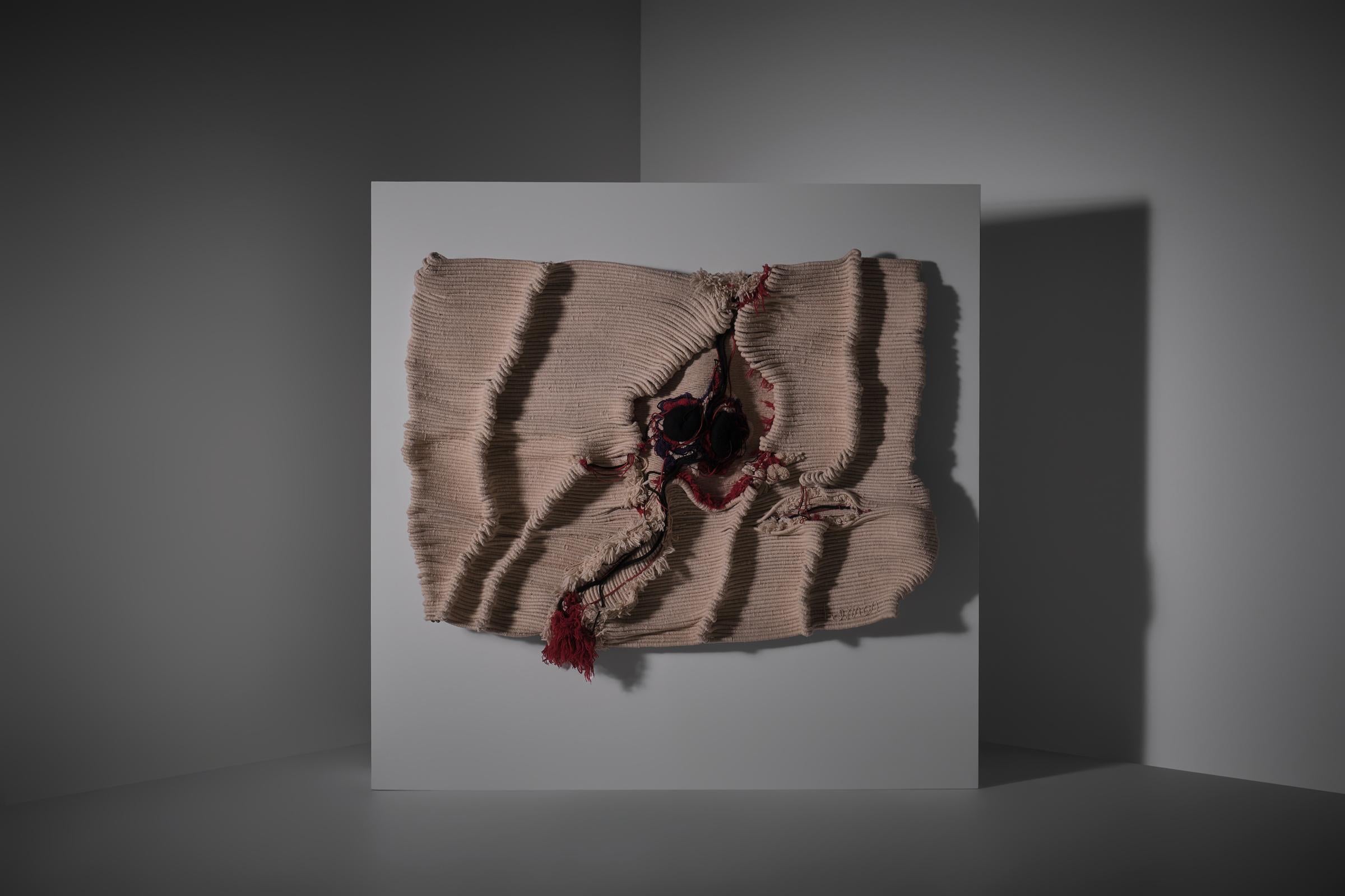Large handwoven sculptural wall tapestry, France 1970s. Made with much tactility and persuasion from fine 100% shear wool and is showing a really great relief and variety of textures resulting in an extraordinary voluminous work. All the ropes and