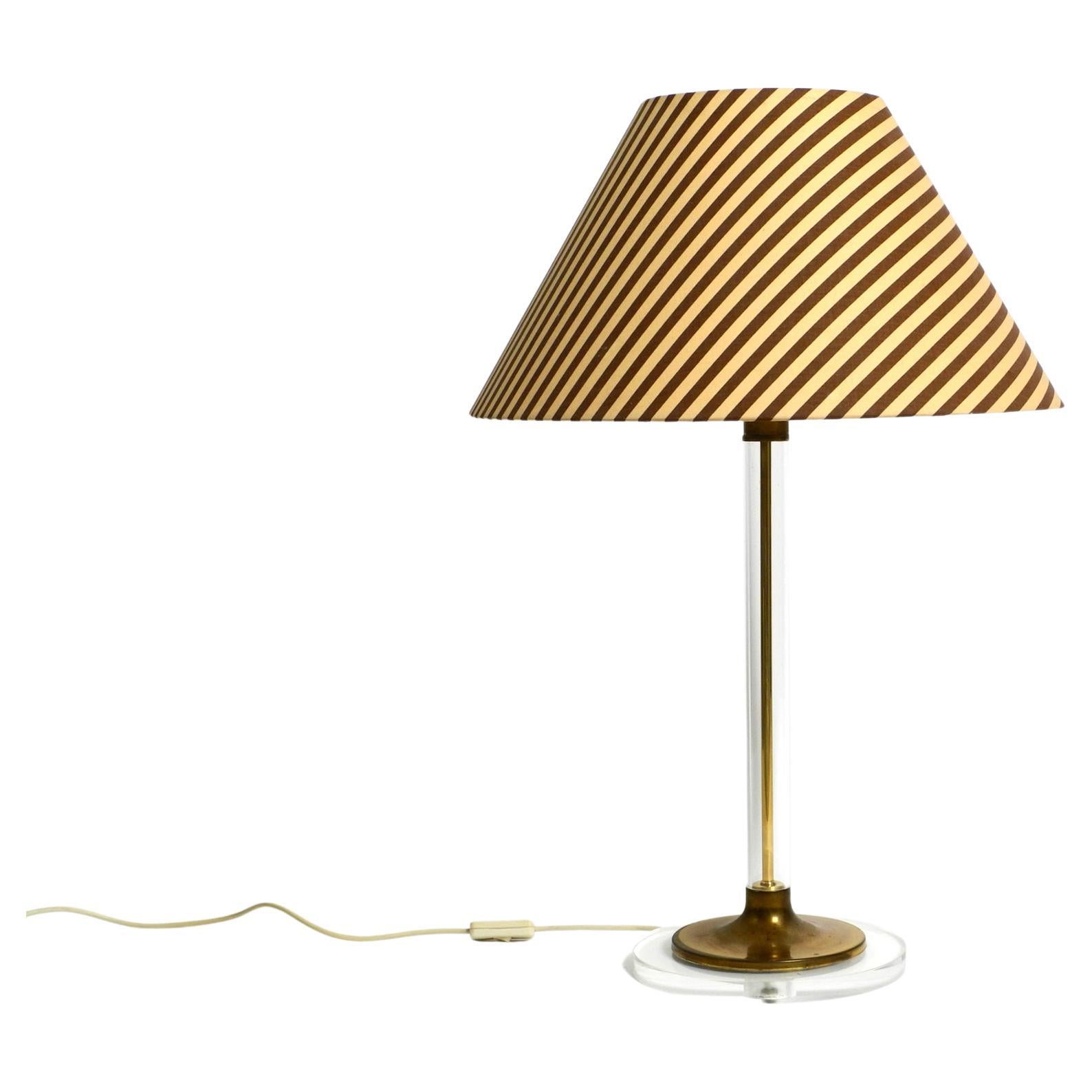 Large plexiglass and brass table lamp from the 1970s by Vereinigte Werkstätten For Sale