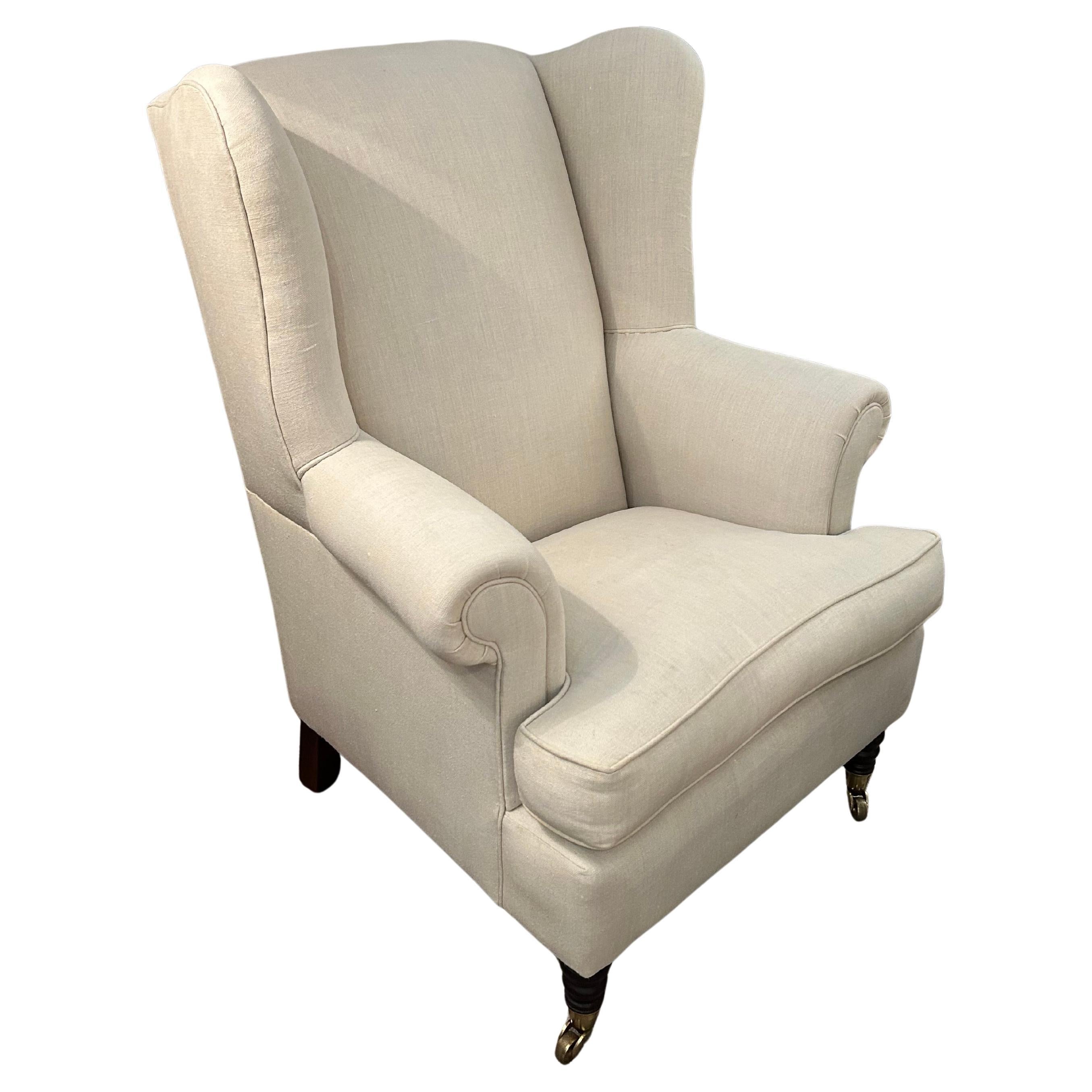 Silla grande con respaldo tapizada en lino y con ruedas en venta