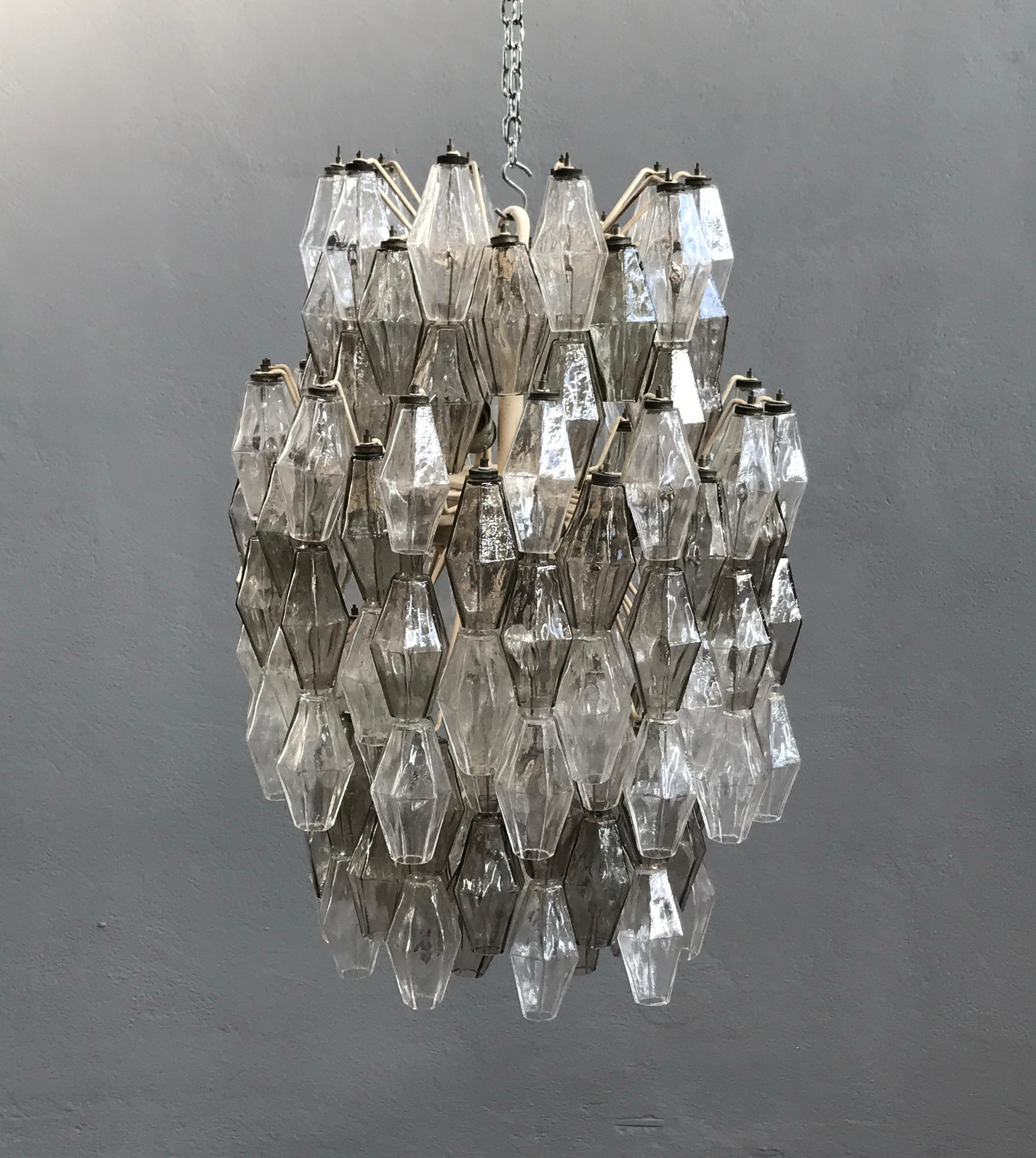 Two-color Poliedri chandelier designed by Carlo Scarpa for Venini.
Painted metal structure marked 