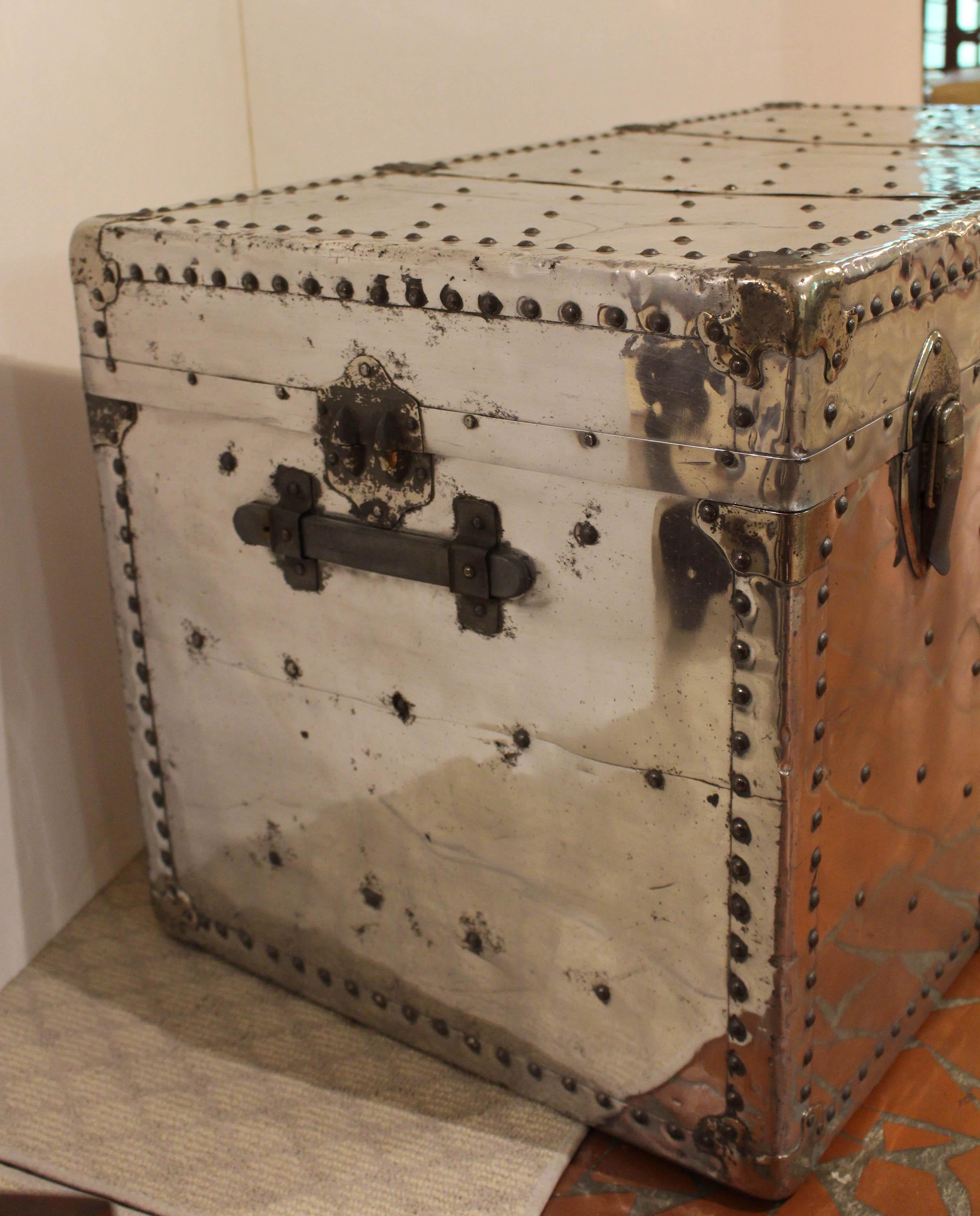 Art Modern, c.1940, large polished aluminum clad aviation travel trunk, English. Extensively studded on all surfaces. Shaped corner protectors. Side carrying handles.

Whitehall Antiques is a family business that has been a major source for the