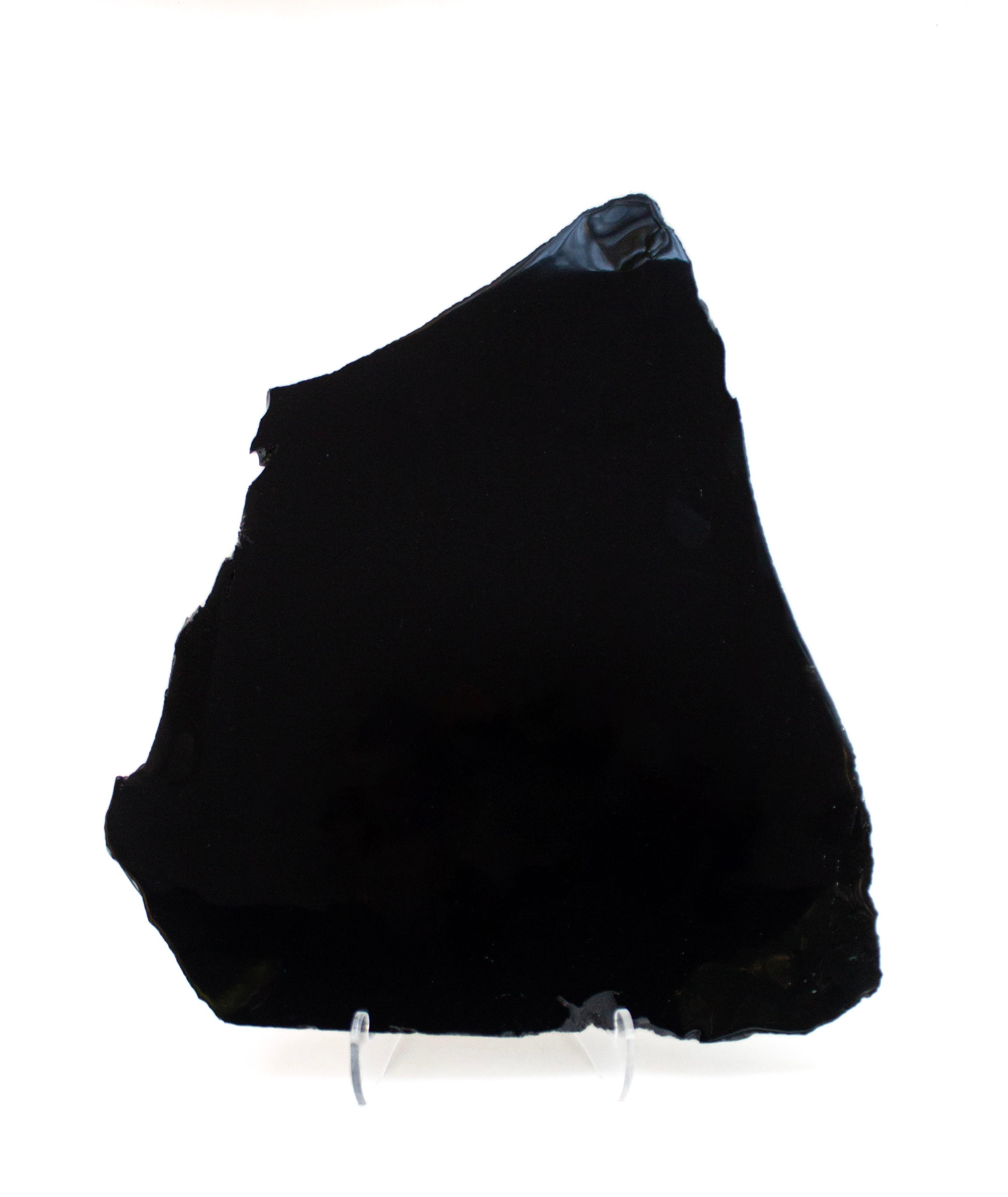 Black polished obsidian slab - similar to what the indigenous Mexican Indians used for their mirrors. 

Obsidian is a naturally occurring volcanic glass formed when lava extruded from a volcano cools rapidly with minimal crystal growth. It is an