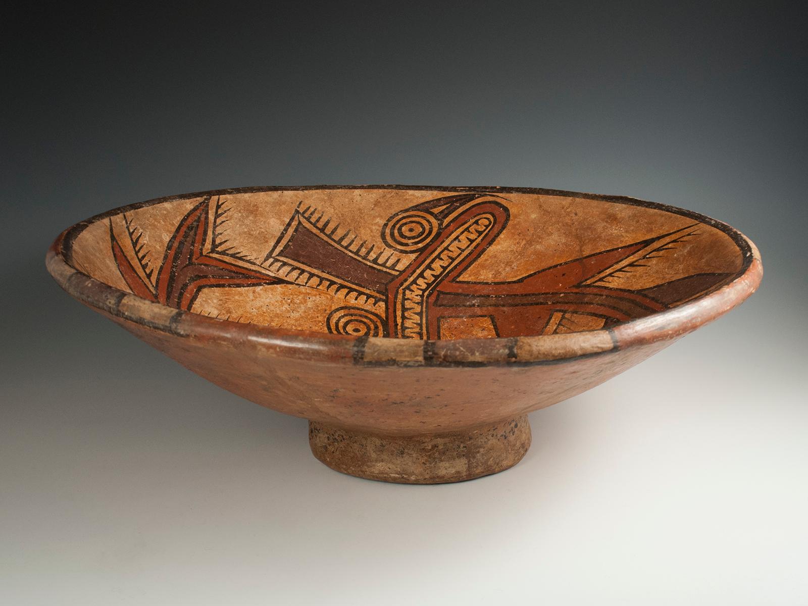 Large Polychrome Fruitera Pedestal Dish, Cocle Culture, Panama

A large pedestal dish with two hammerhead shark-like sea creatures in plum, ochre and black. 16.5? (42 cm) diameter, 6? (15 cm) high.
Ex. private collection, Cedar Rapids,