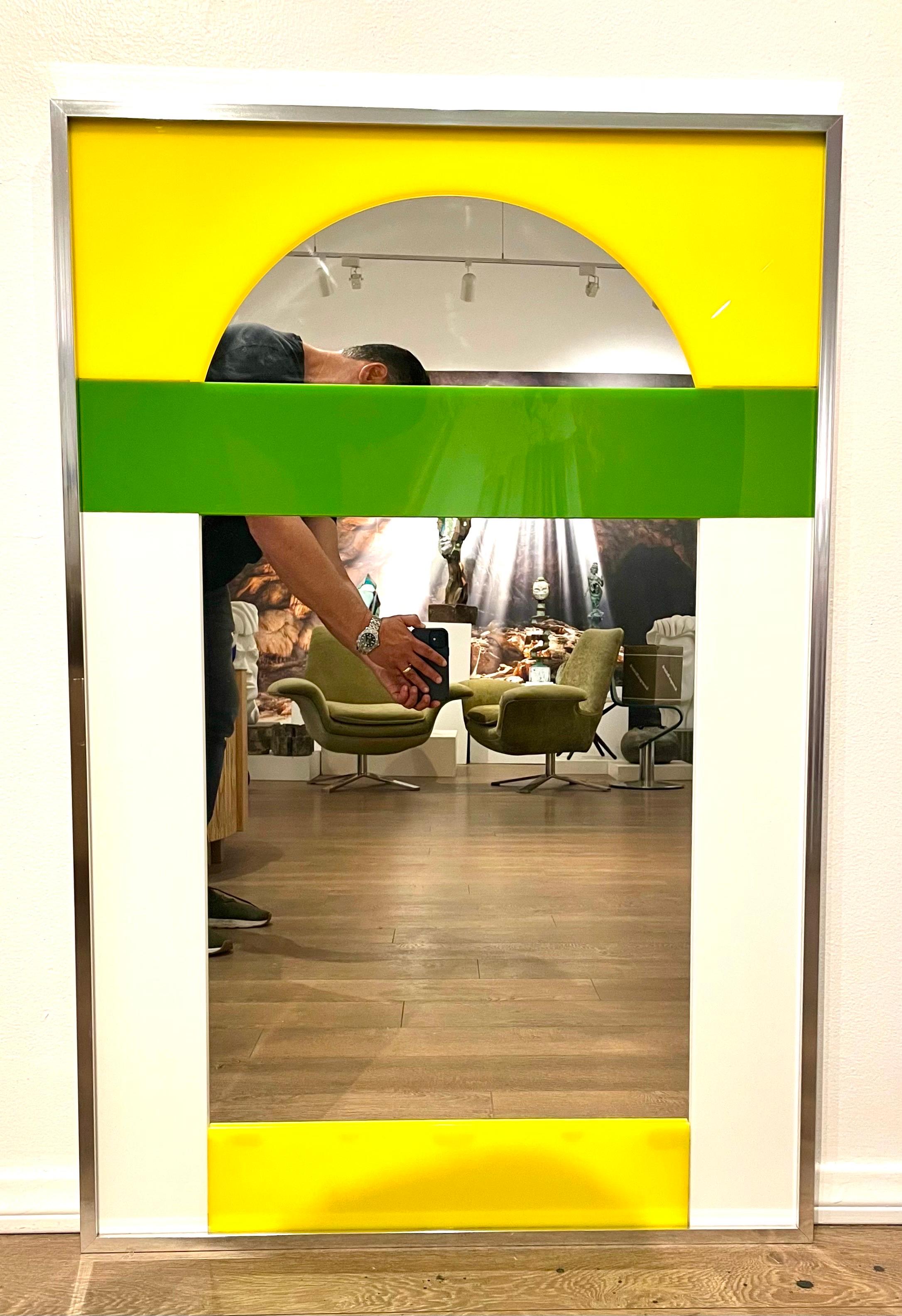 Spectacular large great quality mirror by Carver's Guild, circa 2008 numbered 8/73 in avocado and yellow, white acrylic nice and heavy piece framed in polished aluminum.