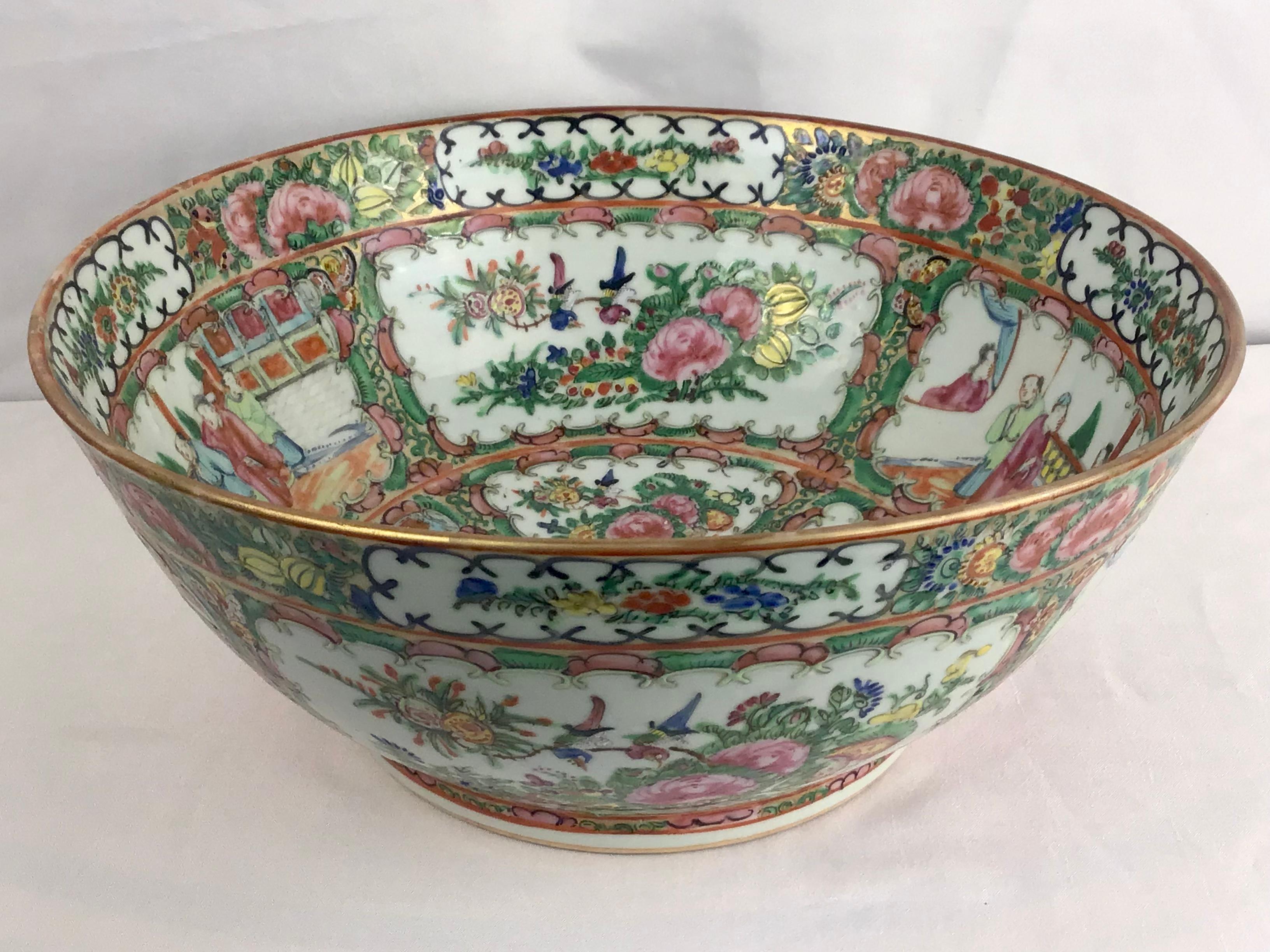 Traditional Chinese Rose Medallion large bowl with social scenes and nature motifs of butterflies, florals, and birds. A very nice larger size bowl! All hand painted with enamel and gilt accents. 