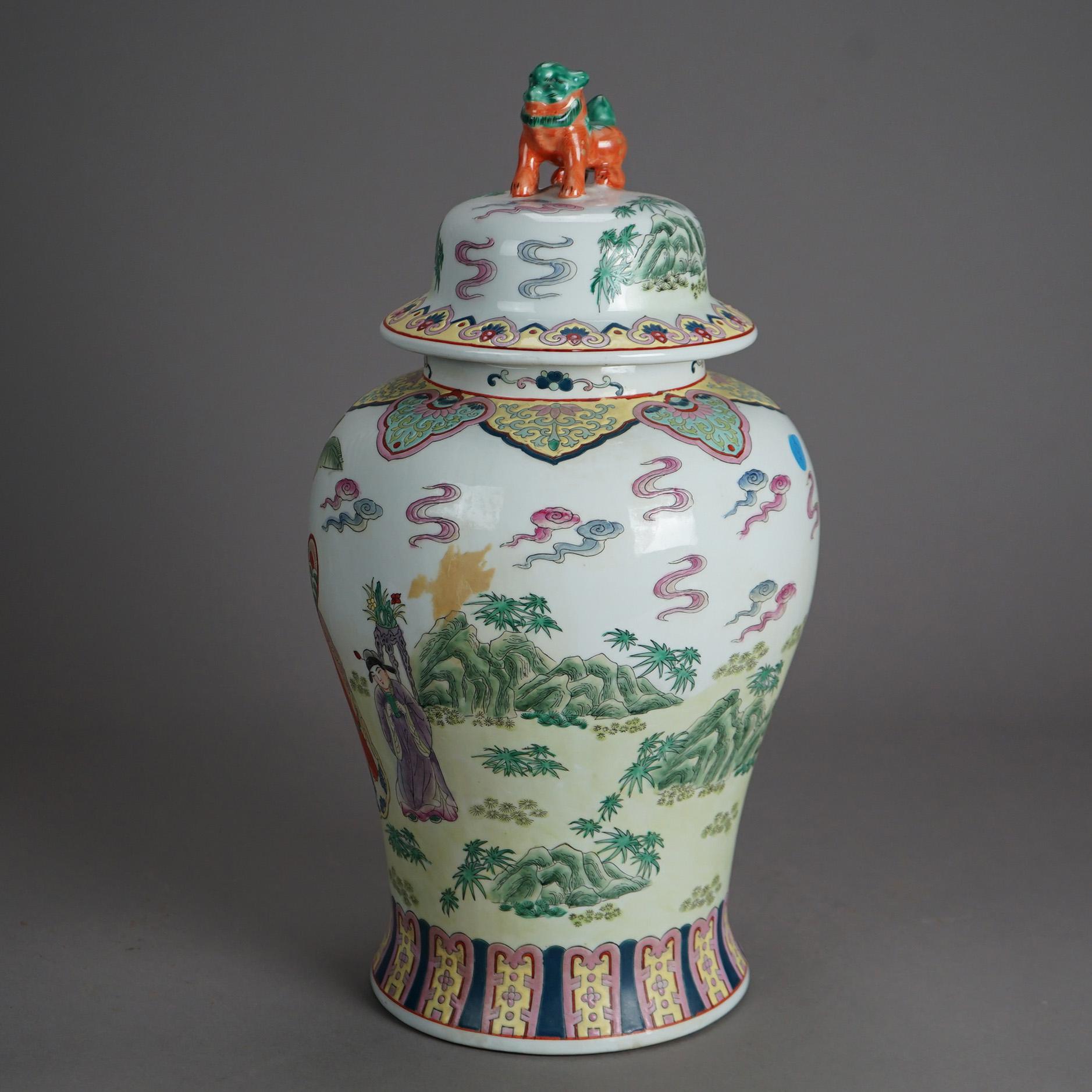 A large Chinese covered urn offers porcelain construction with figural foo dog finial over vessel with hand enameled genre scene and floral elements, stamped on base as photographed, 20th century

Measures- 18.5''H x 9.75''W x 9.75''D