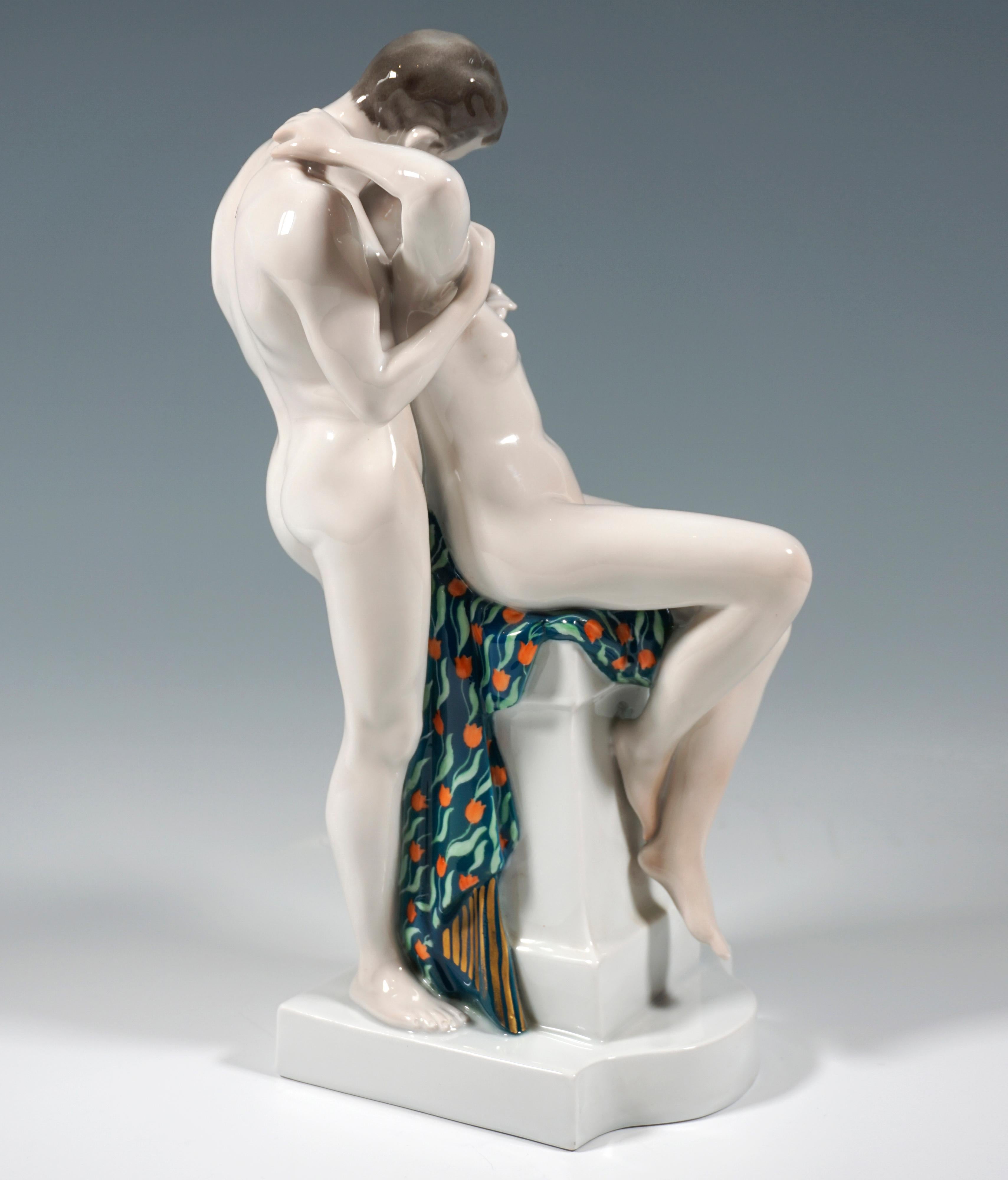 Excellent Large Art Nouveau Group:
Monumental depiction of a pair of lovers in intimate embrace: Unclothed young lady sitting on a pedestal and kissing the naked young man standing behind her. Sparingly painted, only the cloth on which the lady is