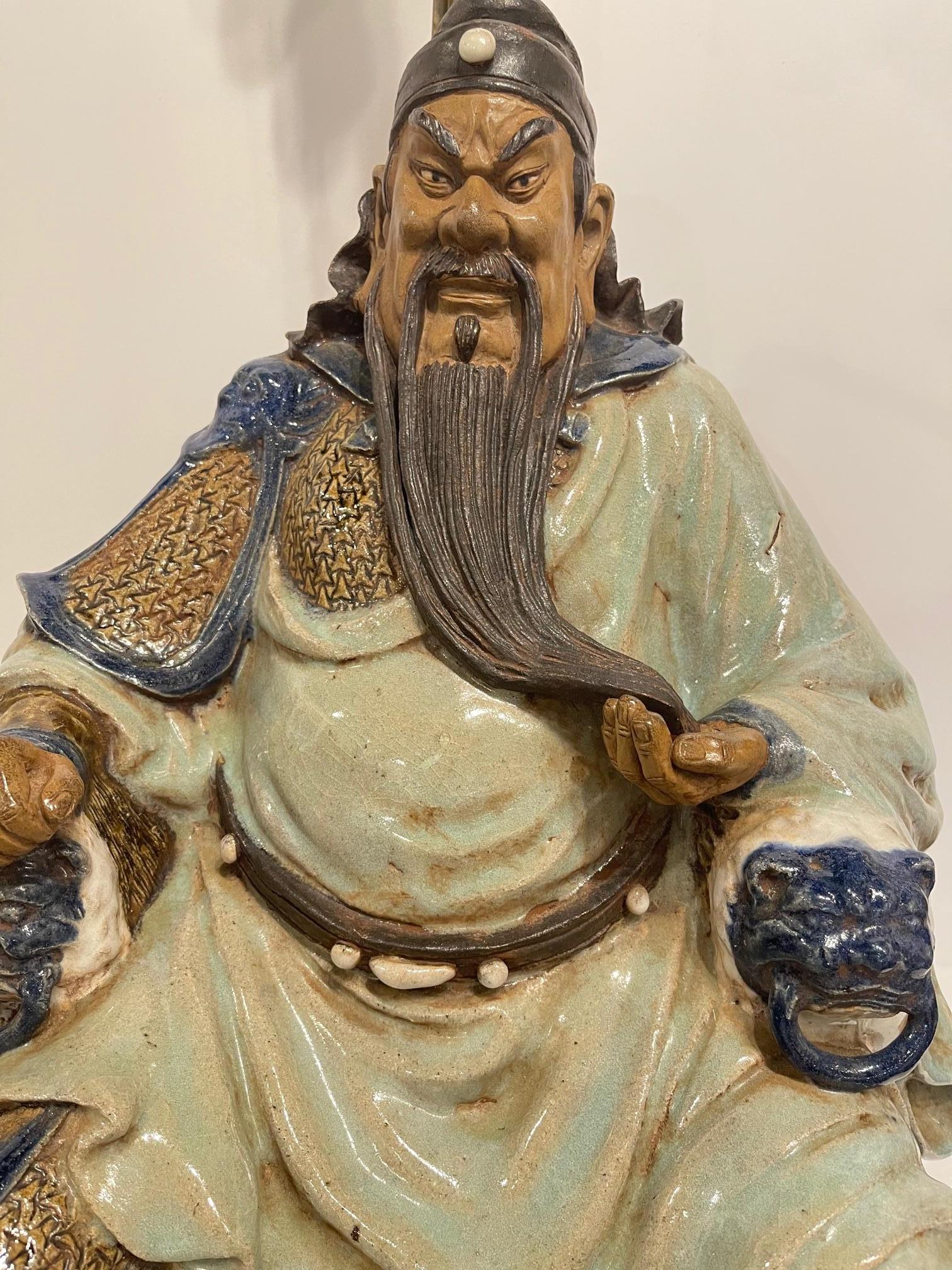Large porcelain of Buddha figure adapted as lamp and wood base, 20th Century.