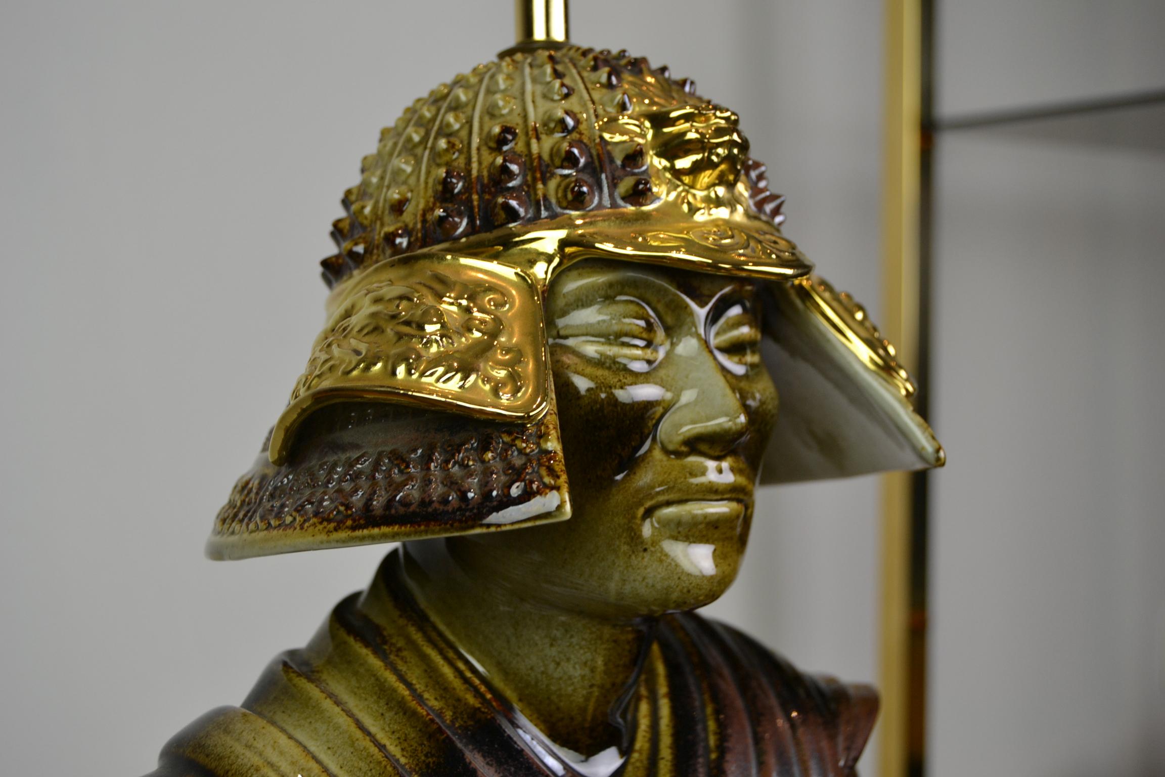 Large porcelain table lamp in the shape of a Samurai.
This brown with gold painted porcelain lamp is very detailed and beautifully made.
It's a vintage Italian Light, there is a crown stamp under with also made in Italy.
Do view all the fine