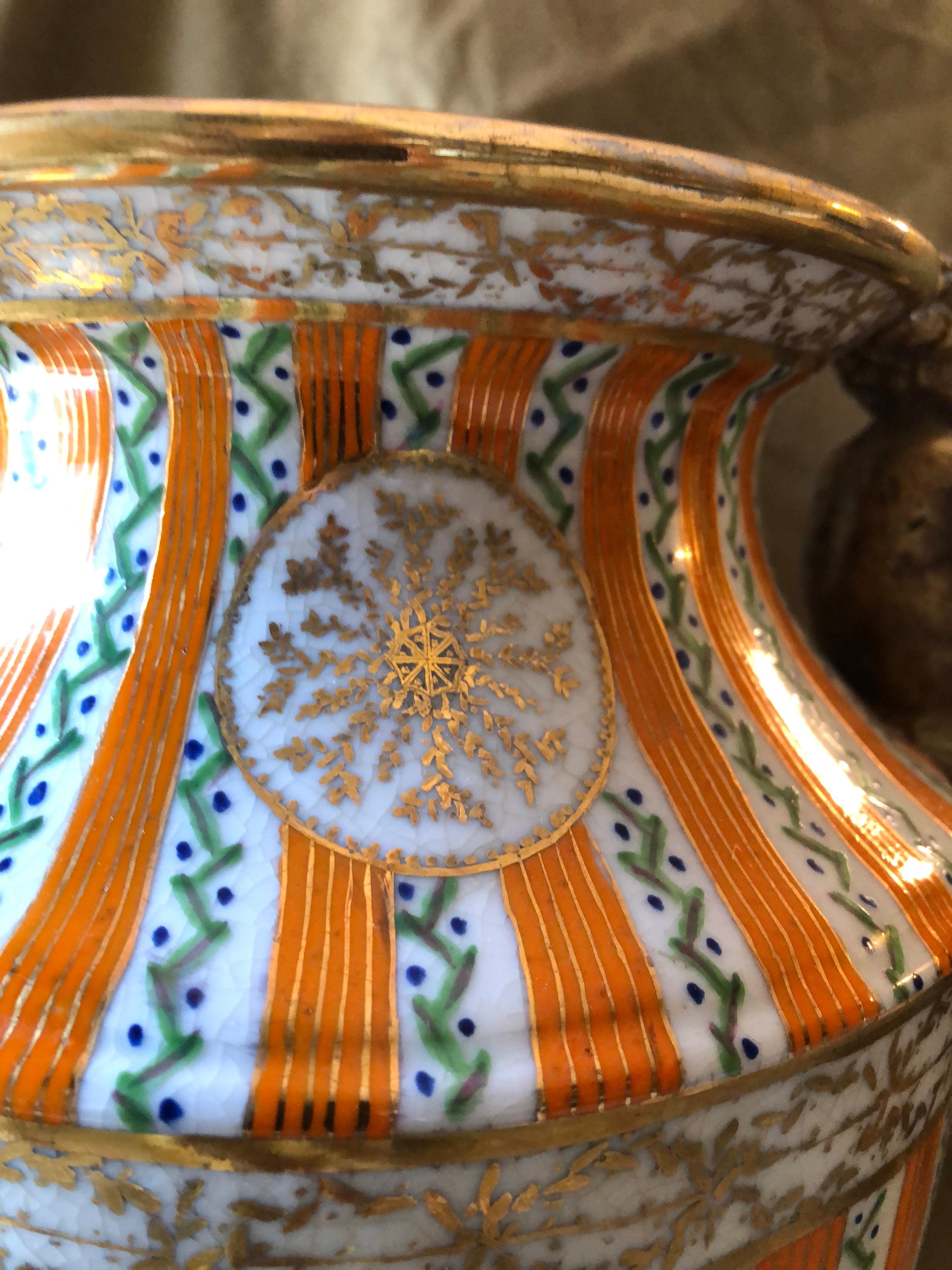 Large Porcelain Urn with Brass Handles and Base, Orange, White and Gold In Excellent Condition For Sale In Harrisburg, PA