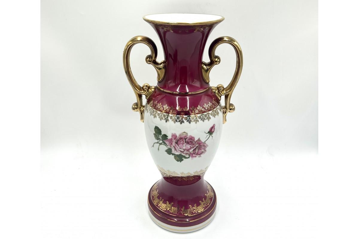A large burgundy porcelain vase with gilding and a floral motif on a white background.

Produced by Zaklady Porcelany Stolowej 