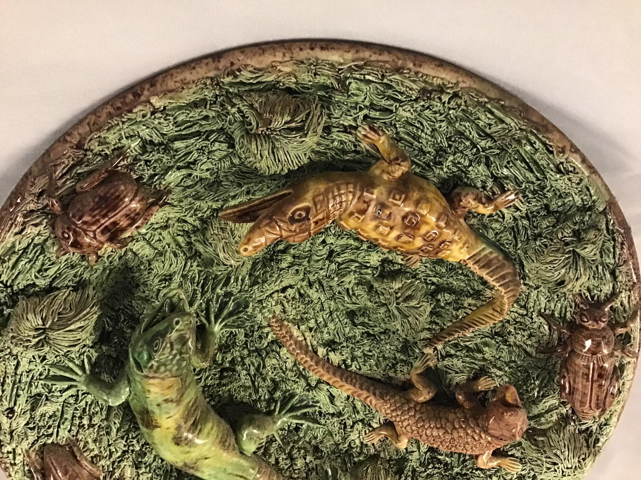 19th Century Portuguese Palissy plate with large alligators, lizards and beatles searching through mossy tuft. Marked on the back Mafra, Caldas.