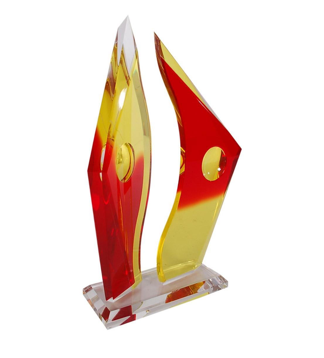 A beautiful and impressive Lucite table sculpture in yellow and red colored acrylic. The table sculpture features two abstract forms on a thick base. Large substantial piece. Signed Vincent. Edition 1 of 299.