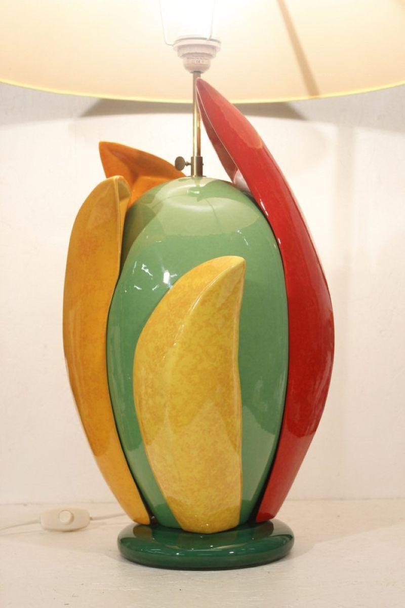 Large ceramic table lamp in post-modern style by François Chatain, France circa 1990. Highly vibrant colors and a very original style, the lampshade can be oriented and adjusted in height to customize the lighting intensity, thanks to the brass part