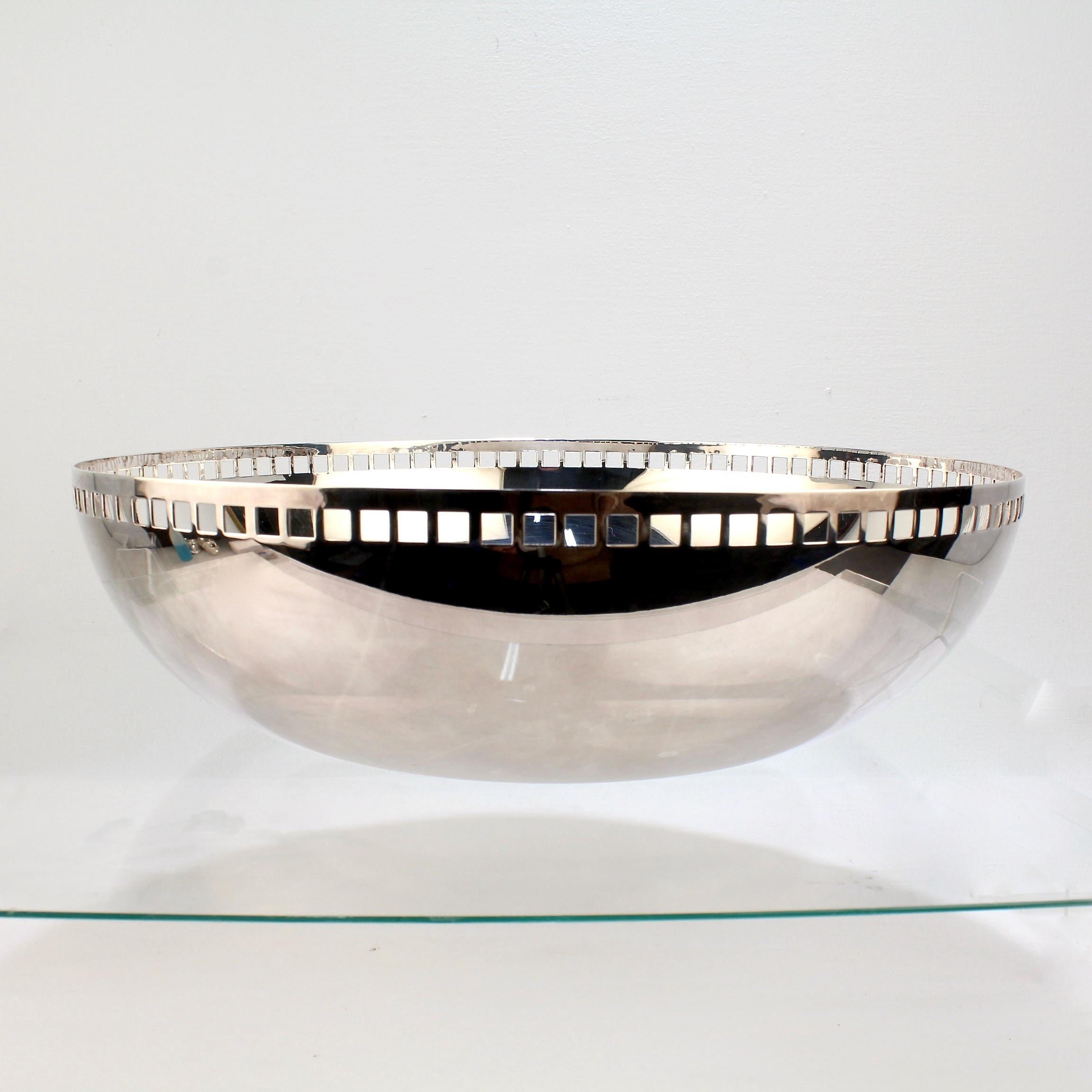 A fine large silver-plated fruit bowl.

Designed by Richard Meier for Swid Powell.

Model no. 3051.

This design was originally named the 'King Richard Bowl' when introduced in 1984. Due to a challenge, the name was changed to 