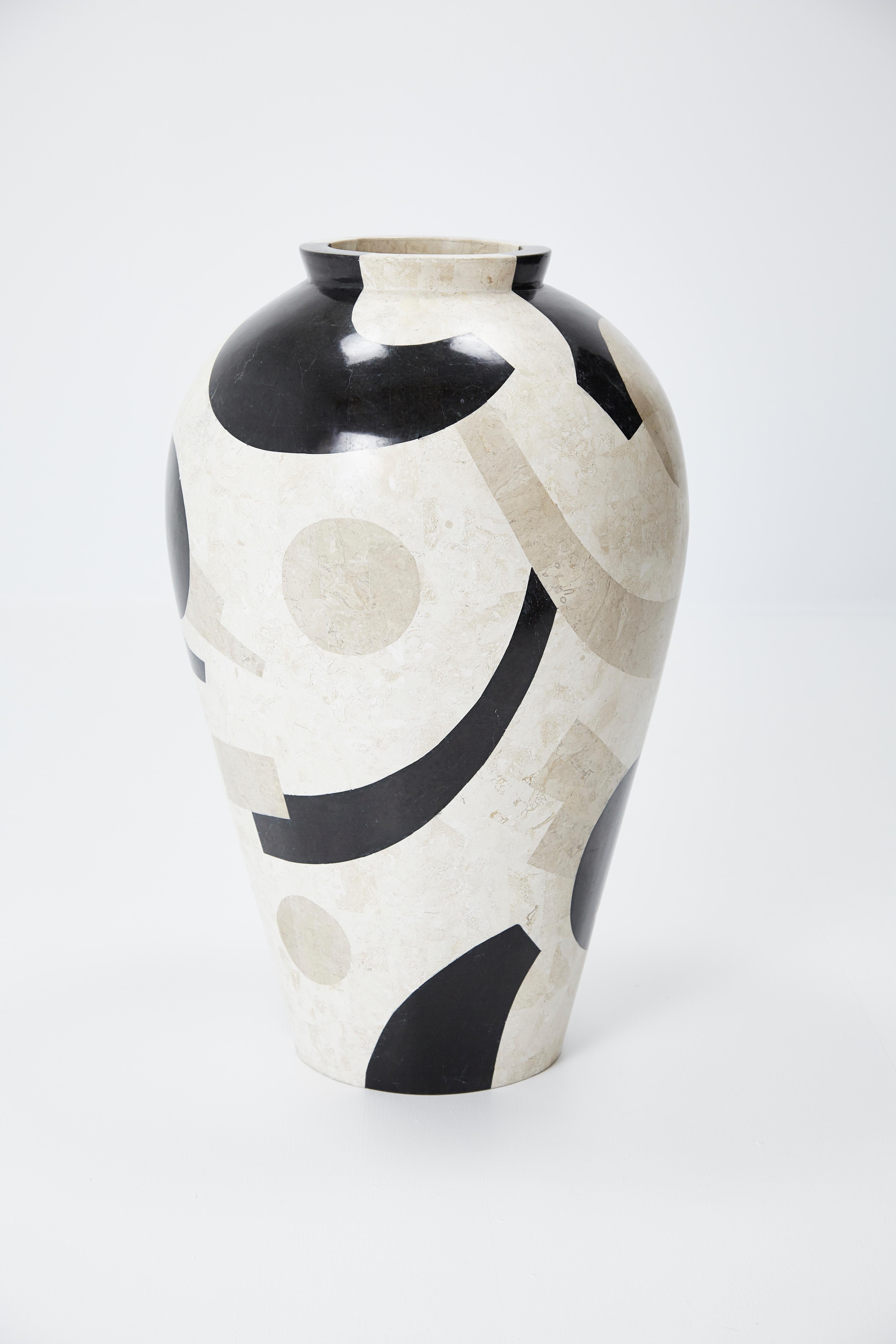 Large mango jar executed in fiberglass with black, cream, and tan tessellated stone covering the exterior in a fun postmodern pattern. Excellent size for a floor vase or planter. Measures 30 in. tall.

All furnishings are made from 100% natural