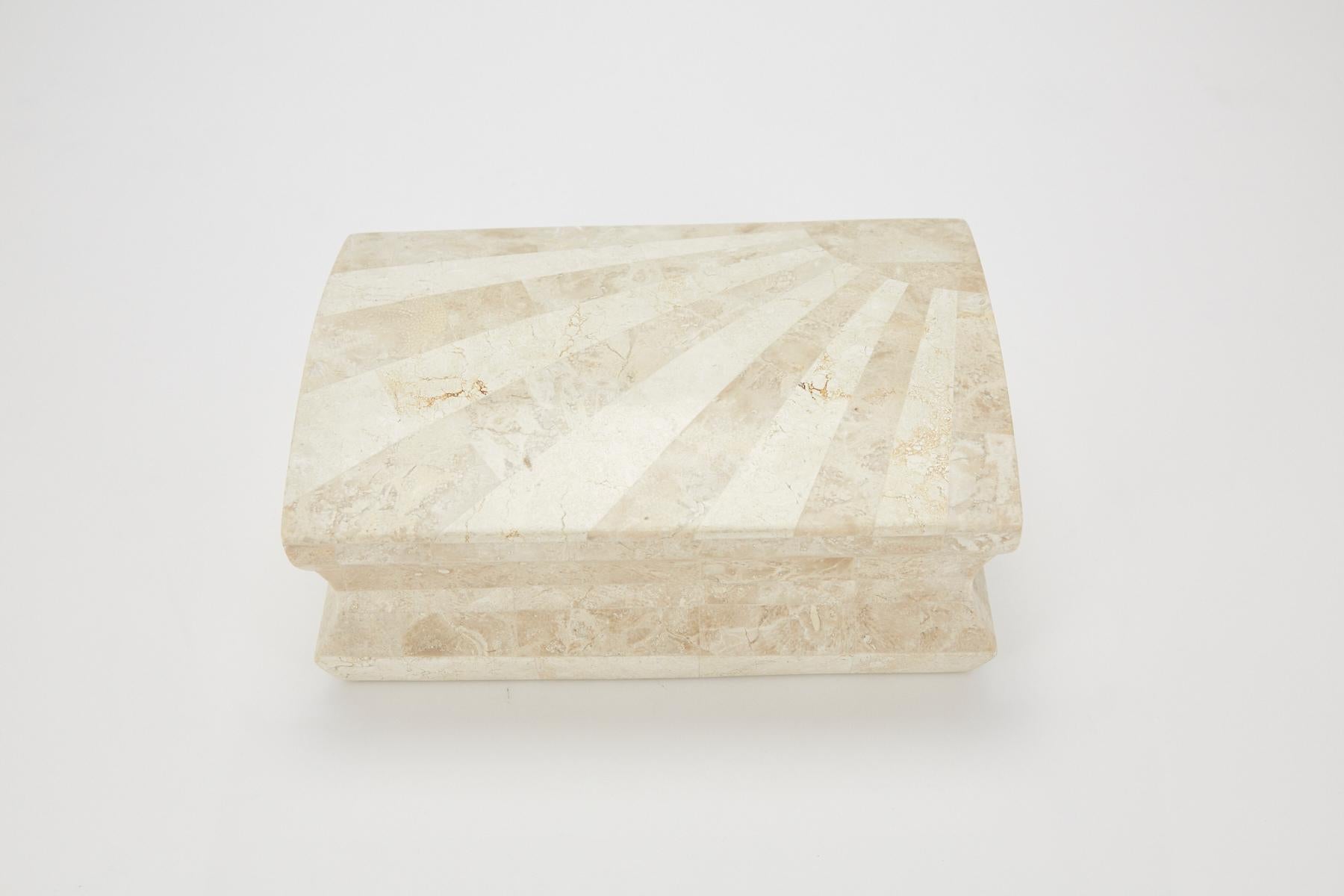 Large hinged decorative box or tea caddy. Exterior completely covered in two-tone tessellated white stone and beige fossil stone in a starburst pattern across the top. Interior of box lined in wood.