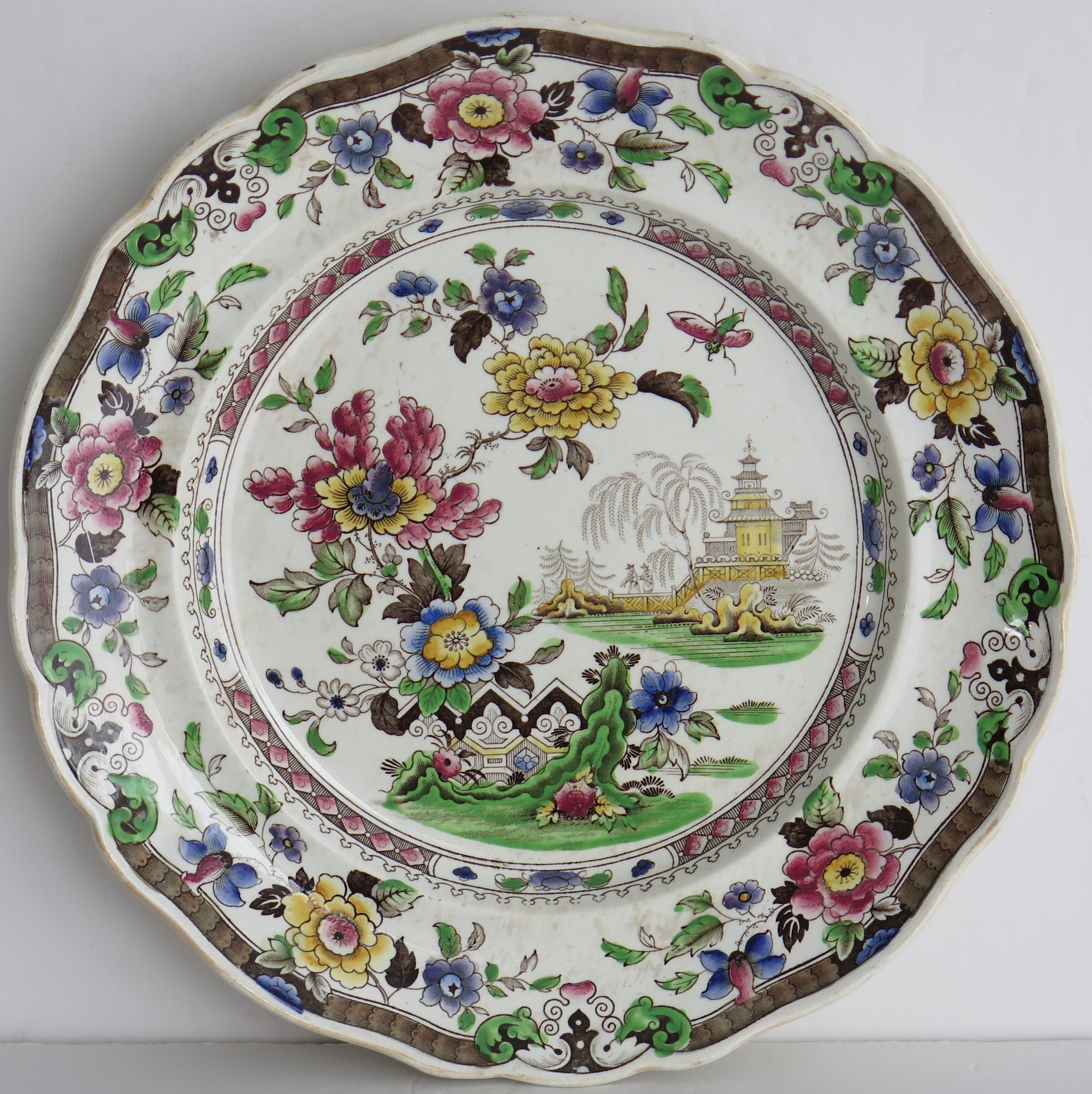 This is a good early decorative large earthenware pottery dinner plates made by Zachariah Boyle of Hanley and Stoke, England, circa 1825.

The plate is well potted with a curvy indented rim.

It has a detailed Chinoiserie pattern depicting a