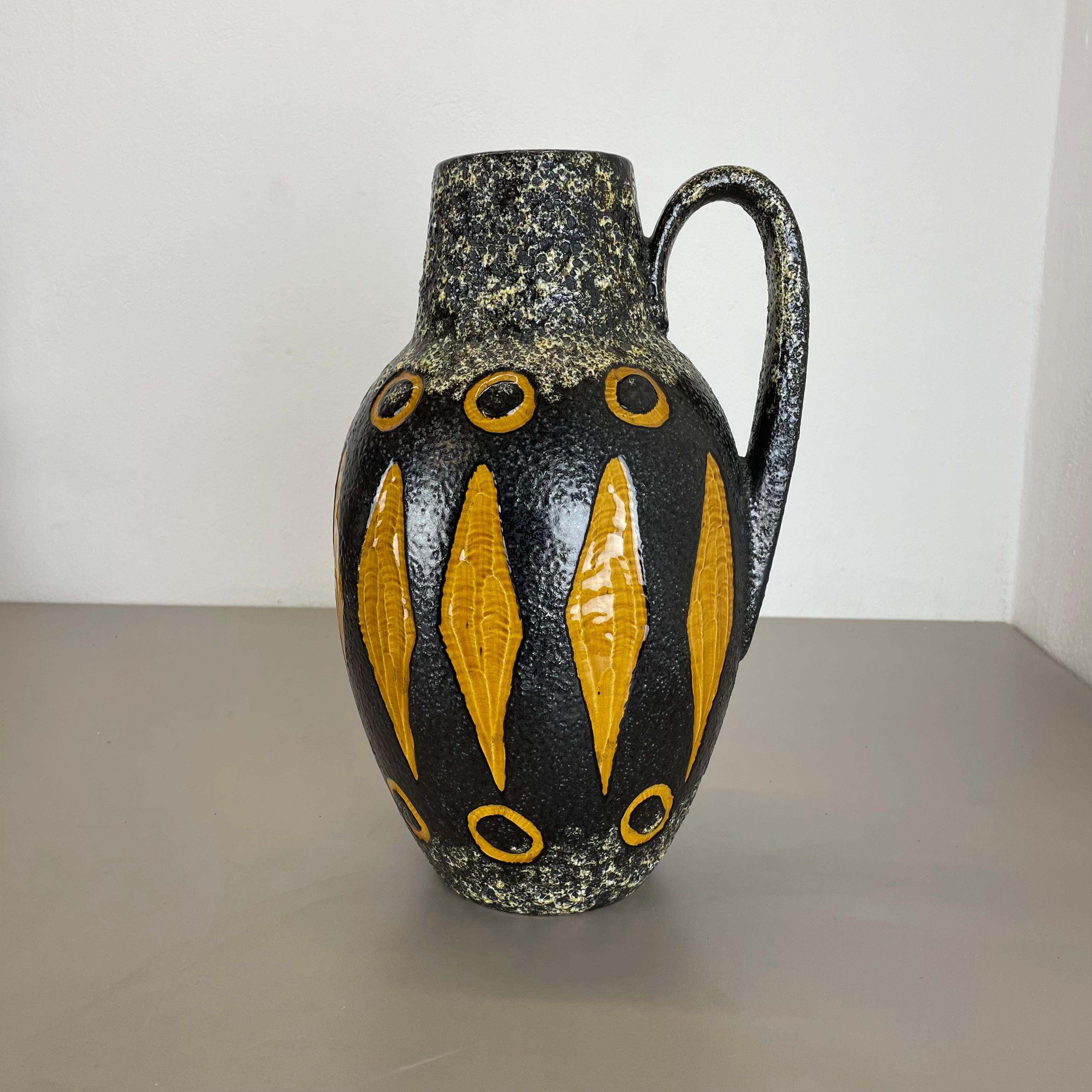 Article:

Fat lava art vase extra large version


Model: 279-38


Producer:

Scheurich, Germany



Decade:

1970s


Description:

This original vintage vase was produced in the 1970s in Germany. It is made of ceramic pottery in fat lava optic with
