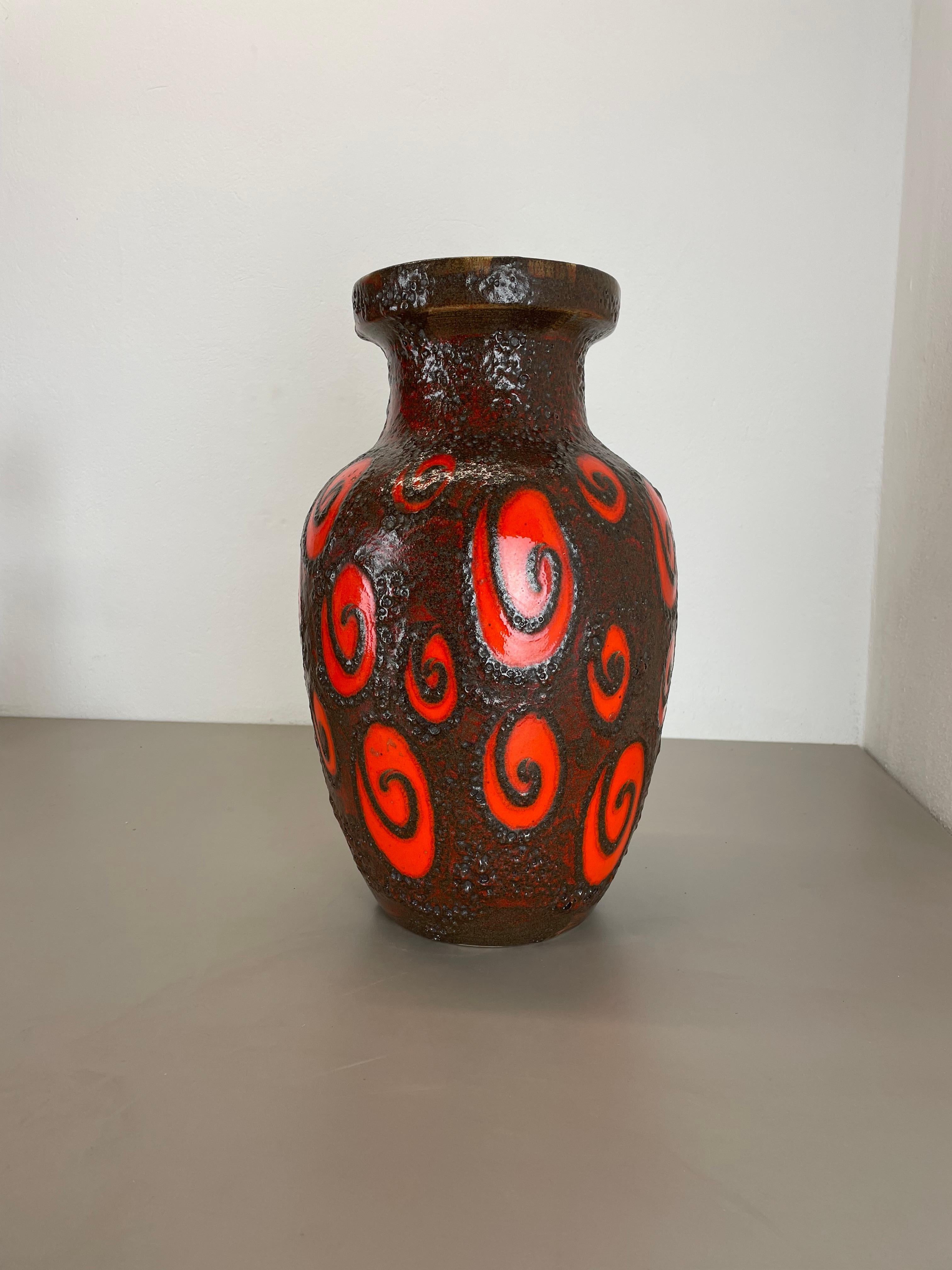 Article:

Fat lava art vase extra large version


Model: 241-47


Producer:

Scheurich, Germany



Decade:

1970s


Description:

This original vintage vase was produced in the 1970s in Germany. It is made of ceramic pottery in fat lava optic with