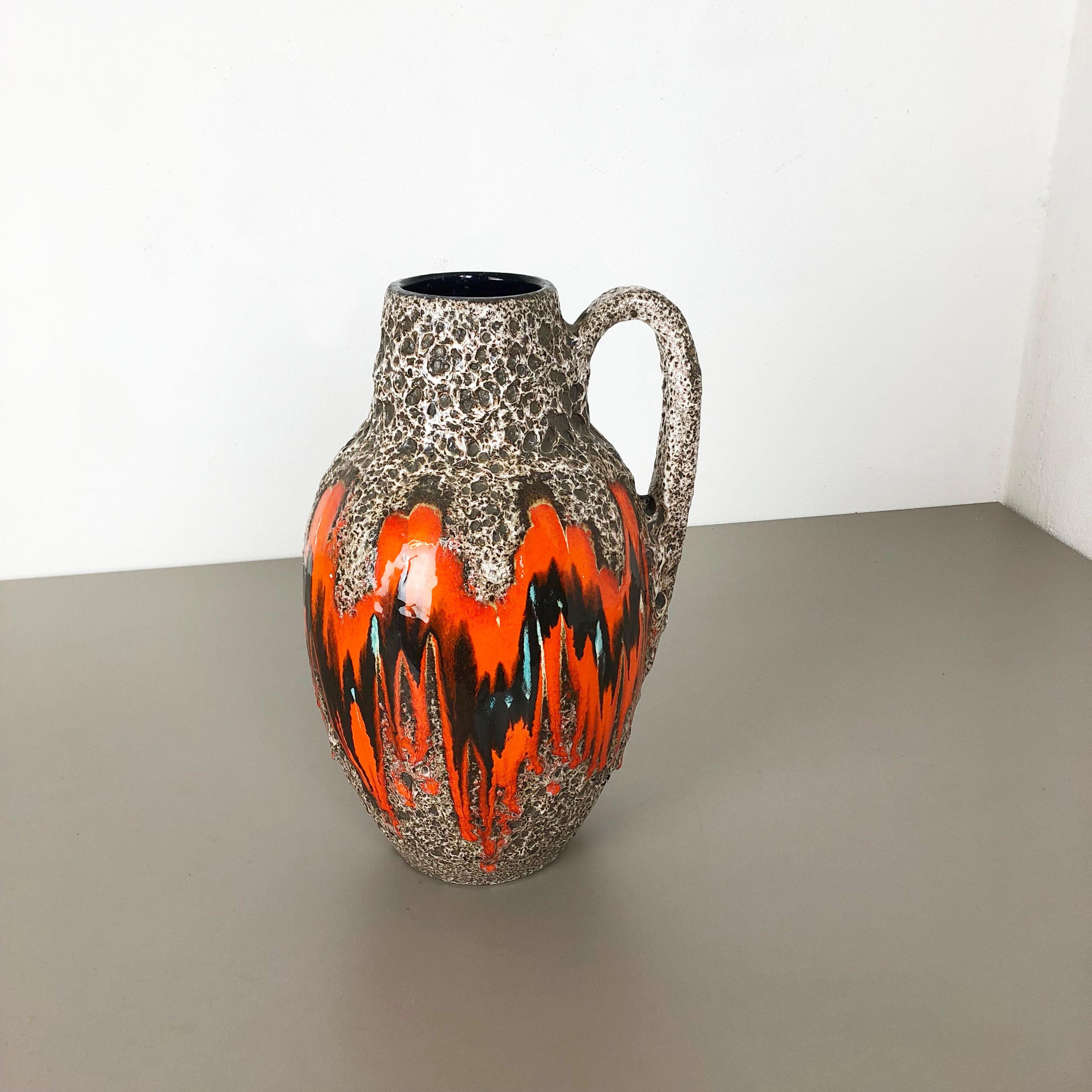 Article:

Fat lava art vase extra large version


Model: 414-38


Producer:

Scheurich, Germany



Decade:

1970s


Description:

This original vintage vase was produced in the 1970s in Germany. It is made of ceramic pottery in