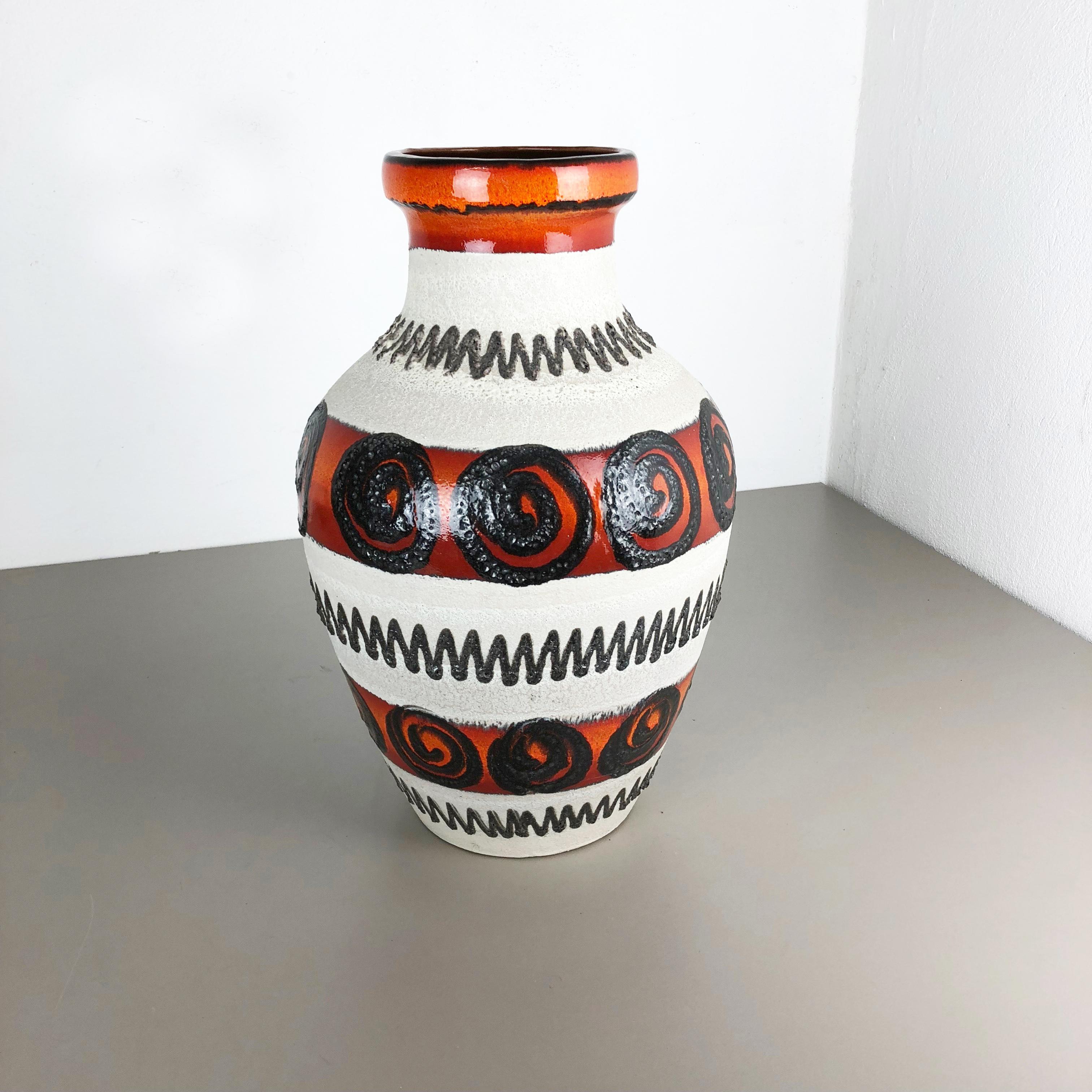 Article:

Fat lava art vase XXXL version



Producer:

Scheurich, Germany



Decade:

1970s


Description:

This original vintage vase was produced in the 1970s in Germany. It is made of ceramic pottery in fat lava optic with