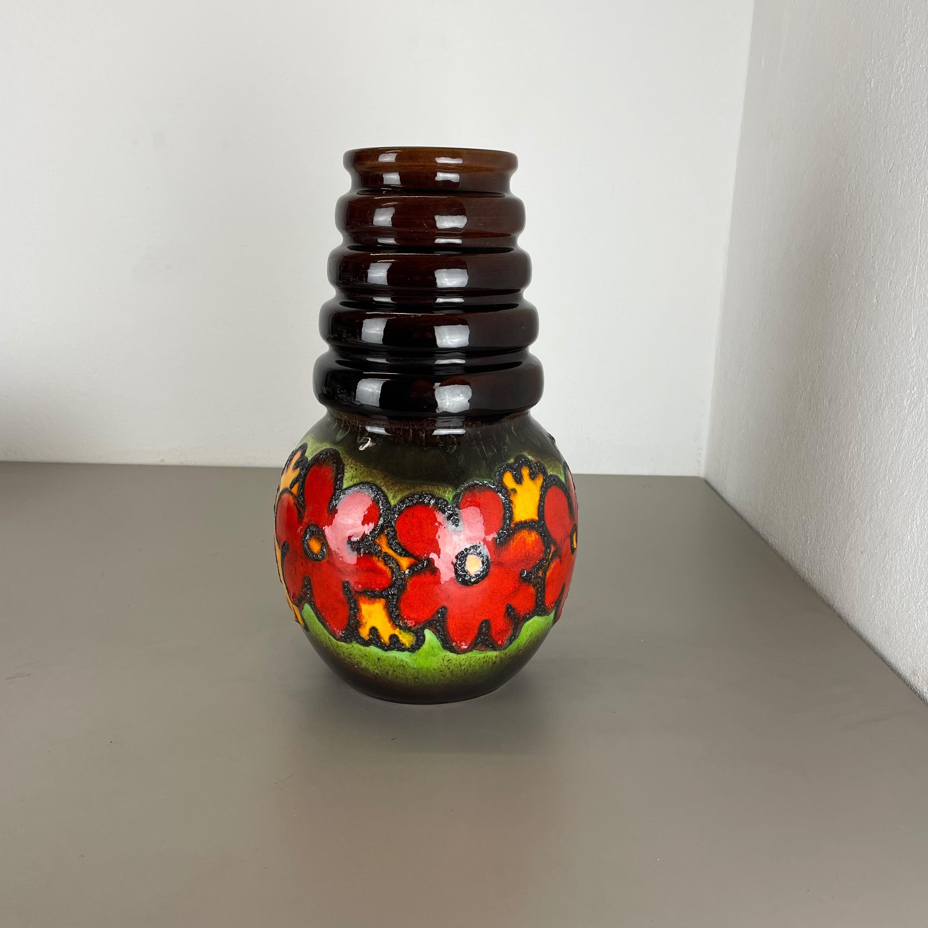 Article:

Fat lava art vase extra large version with floral illustration.




Producer:

Scheurich, Germany



Decade:

1970s


Description:

This original vintage vase was produced in the 1970s in Germany. It is made of ceramic