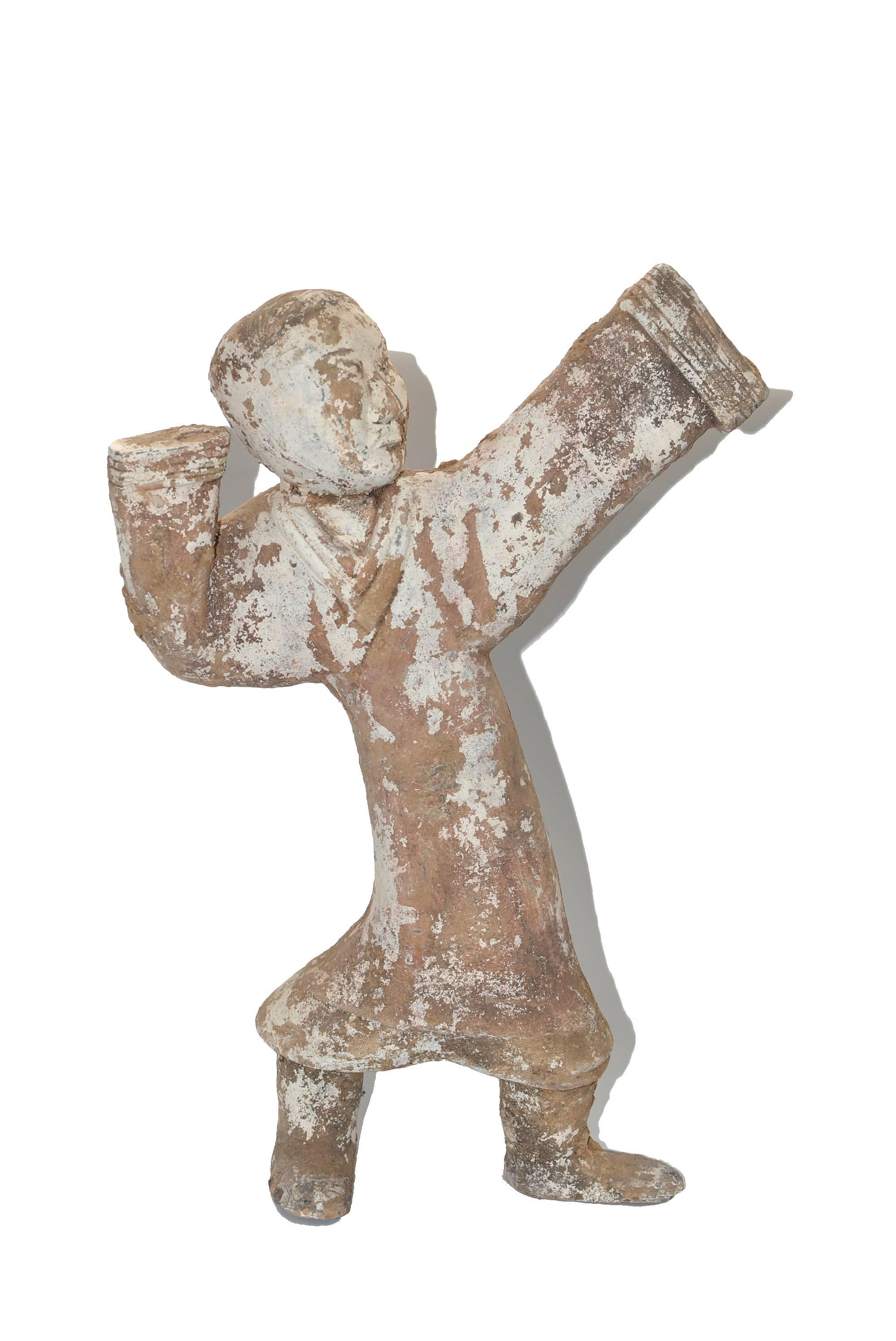 A fantastic, extra large, Han style terracotta figure. Such a figure is seen in the Han dynasty dating 206 BC-220 AD. The figure is in the motion of a ceremonial dance. Either a servant or a dancer, such a statue was regarded as a status symbol and