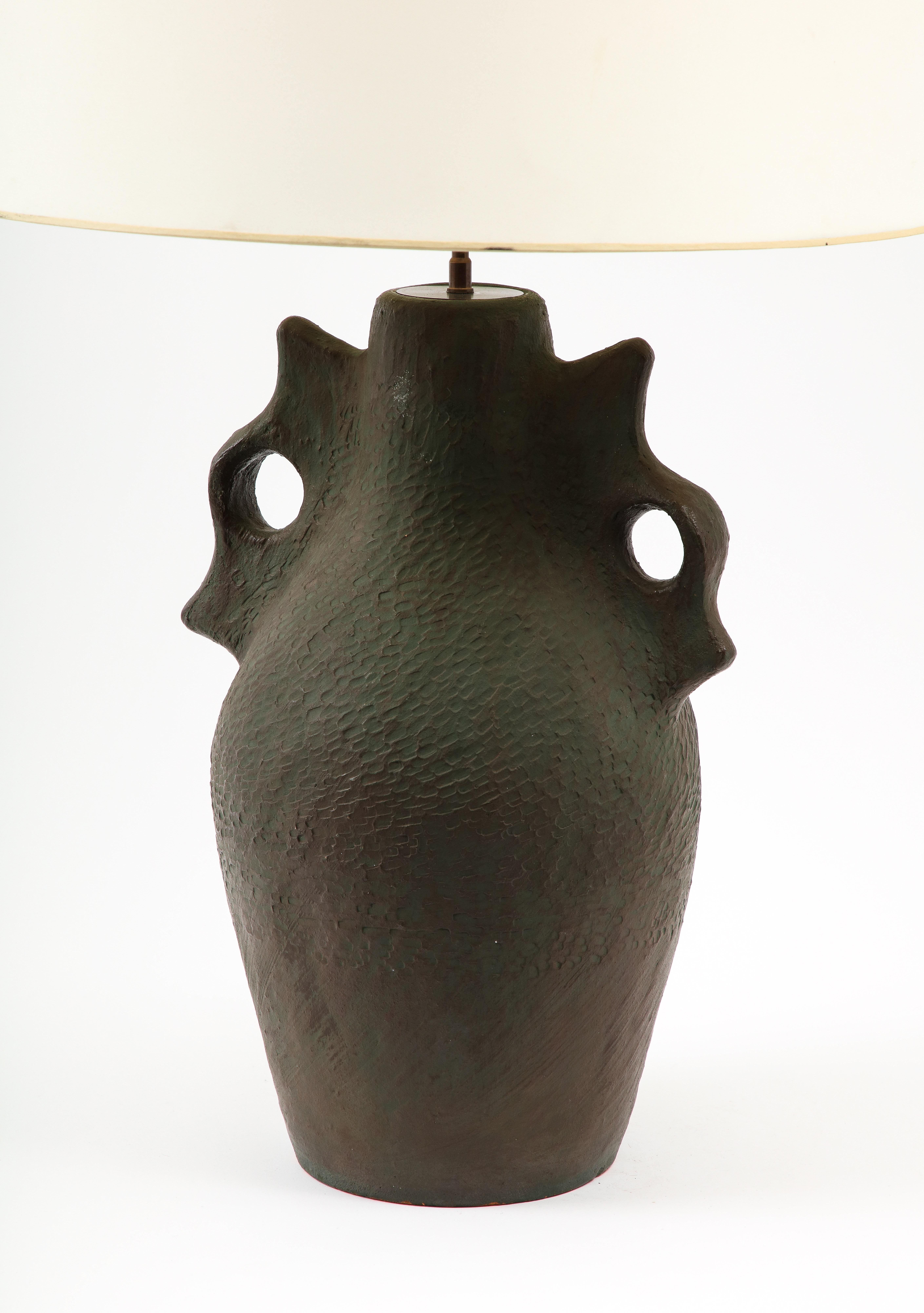 Giant terracotta lamp with a distinct glazing technique that gives it the appearance of antique bronze, the style is reminiscent of ancient Greek vessels.
The base only is 26