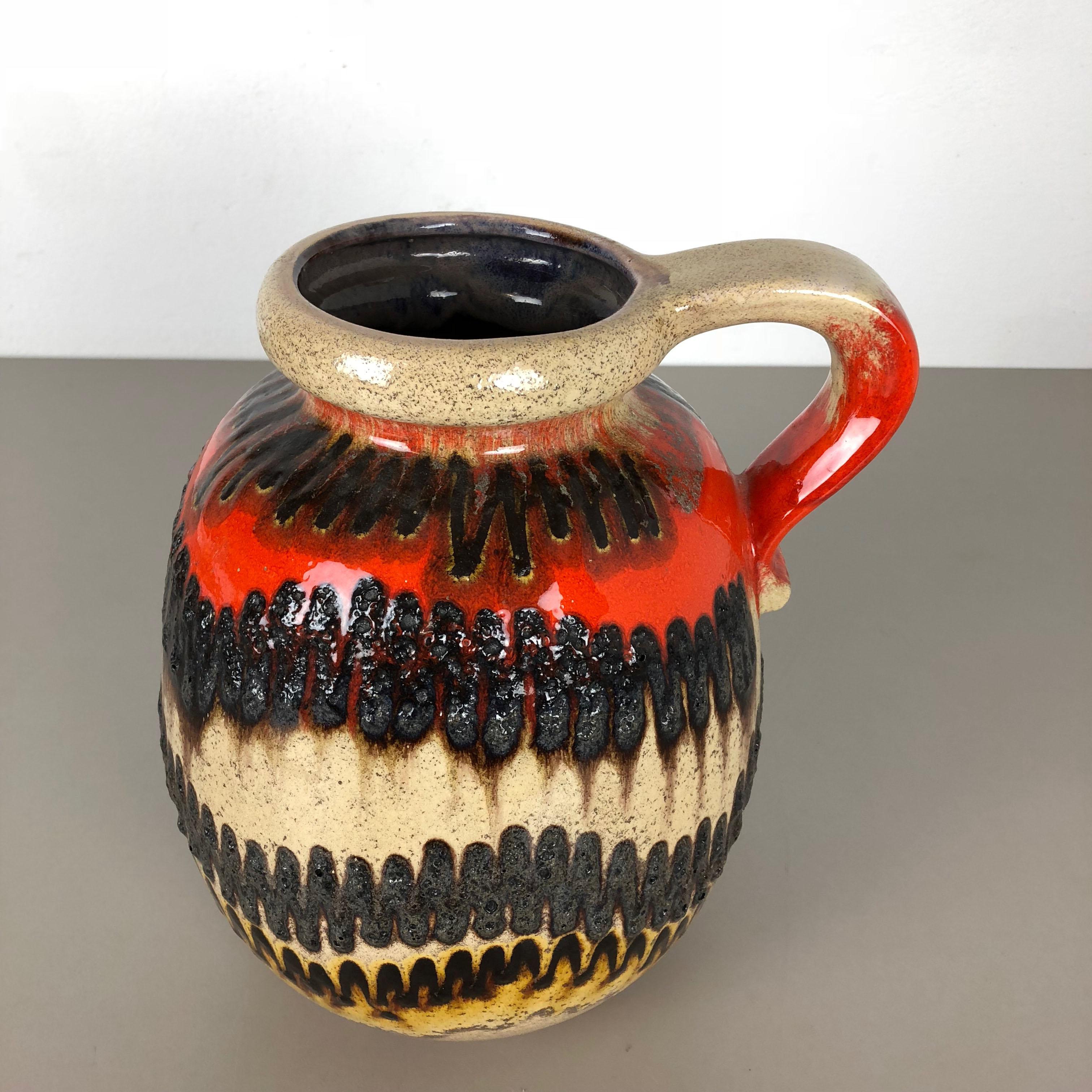 Article:

Fat lava art vase extra large version


Model: 484-30


Producer:

Scheurich, Germany



Decade:

1970s




This original vintage vase was produced in the 1970s in Germany. It is made of ceramic pottery in fat lava