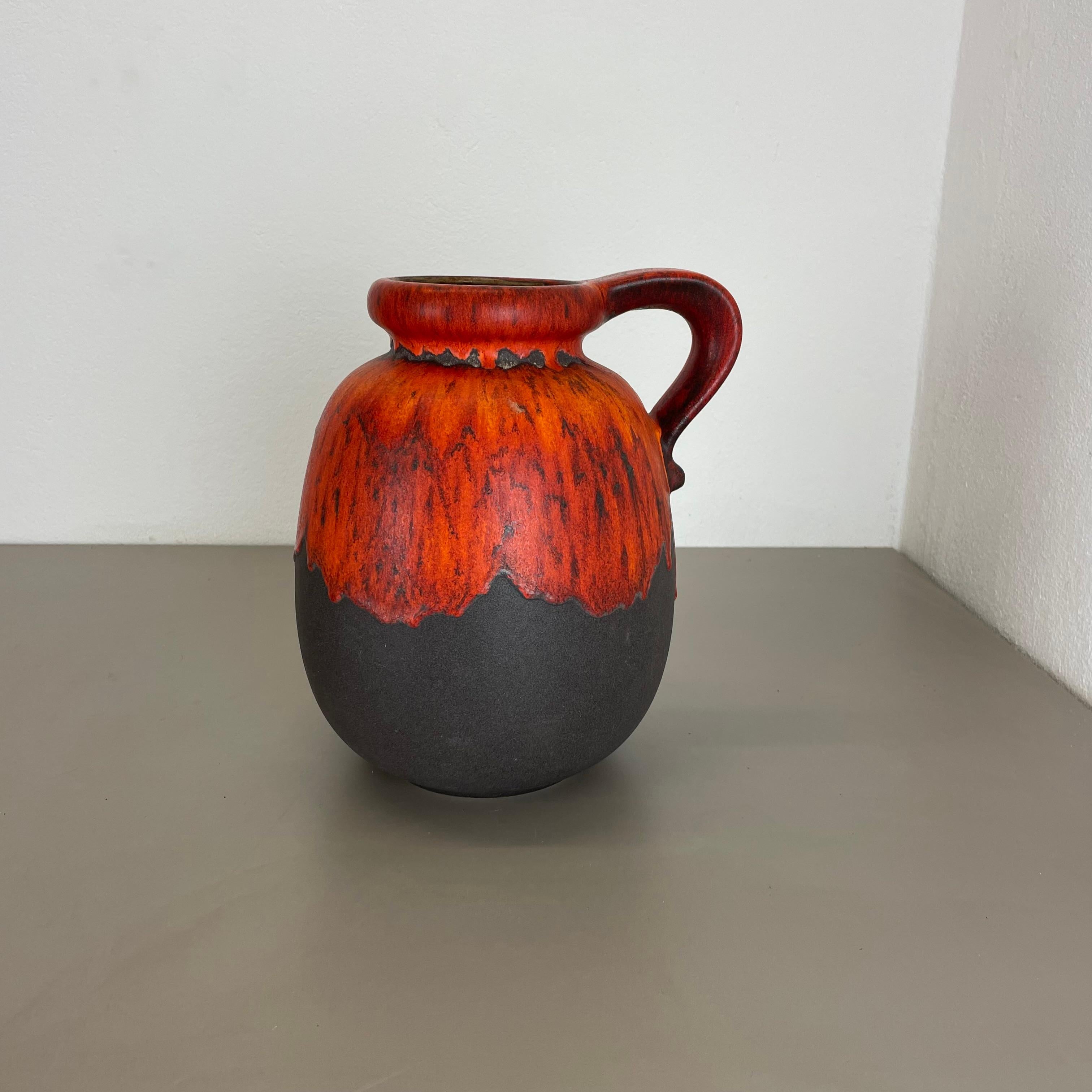 Article:

Fat lava art vase


Model: 484-30


Producer:

Scheurich, Germany



Decade:

1970s




This original vintage vase was produced in the 1970s in Germany. It is made of ceramic pottery in fat lava optic with abstract illustration in very