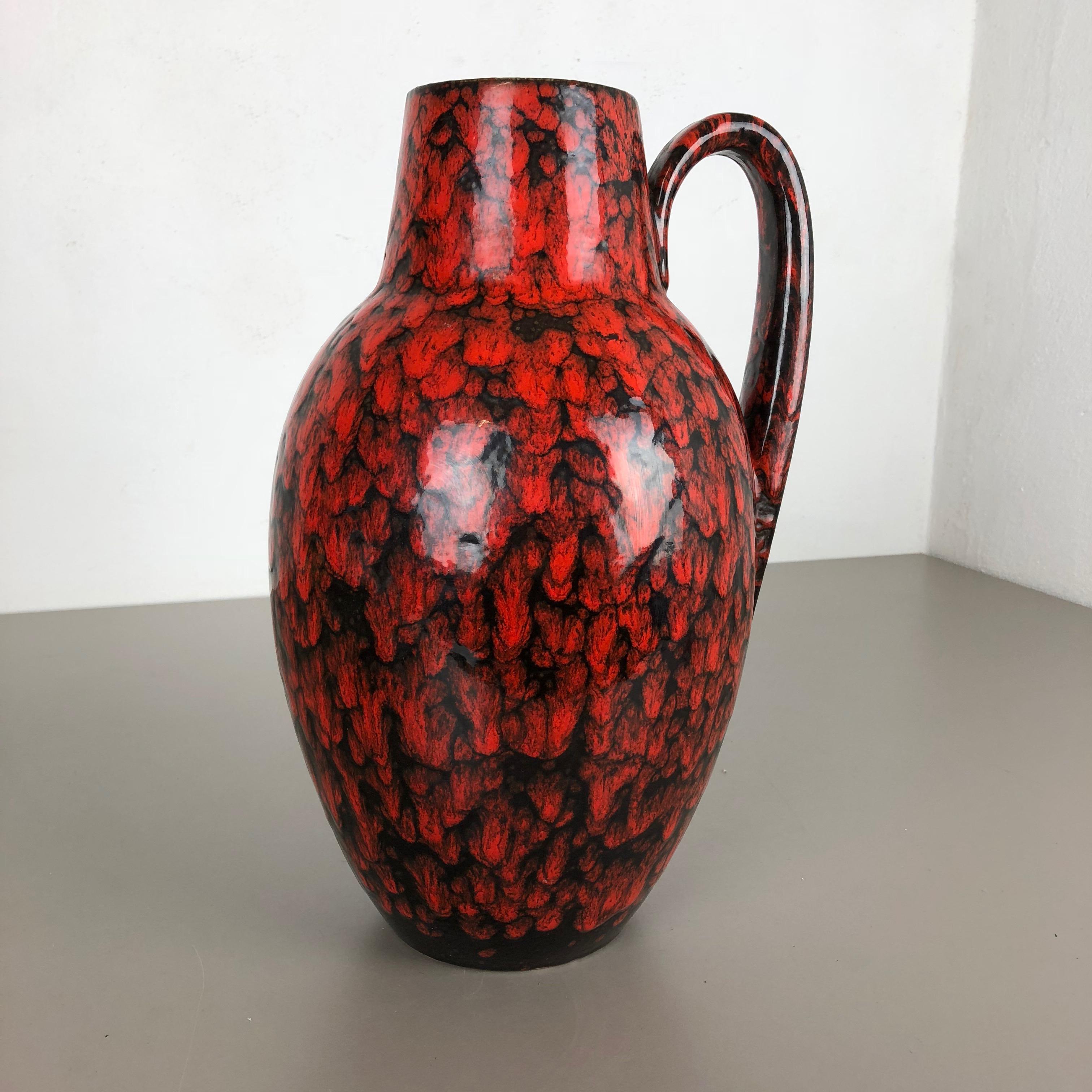 Article:

Fat lava art vase extra large version


Model: 270-38


Producer:

Scheurich, Germany



Decade:

1970s


This original vintage vase was produced in the 1970s in Germany. It is made of ceramic pottery in fat lava optic with abstract dots
