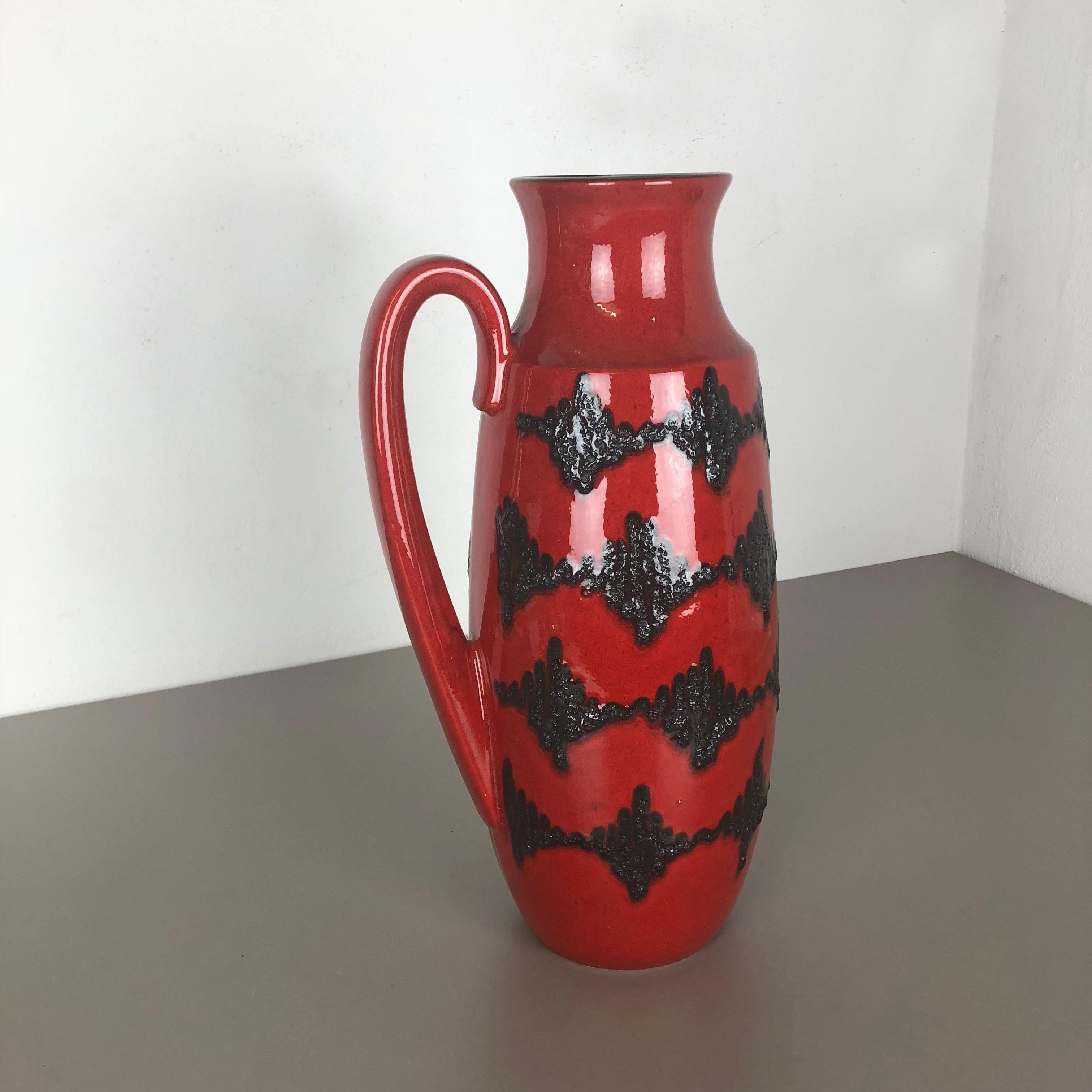 Article:

Fat lava art vase extra large version


Model: 426-47


Producer:

Scheurich, Germany



Decade:

1970s




This original vintage vase was produced in the 1970s in Germany. It is made of ceramic pottery in fat lava