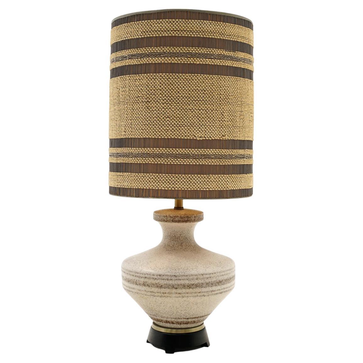 Ceramic table lamp with the original shade that when lit looks like a shade within the shade.  No chips, cracks or repairs.  Holds three light bulbs.  Very high quality in the style of Gordon and Jane Martz for Marshall Studios.