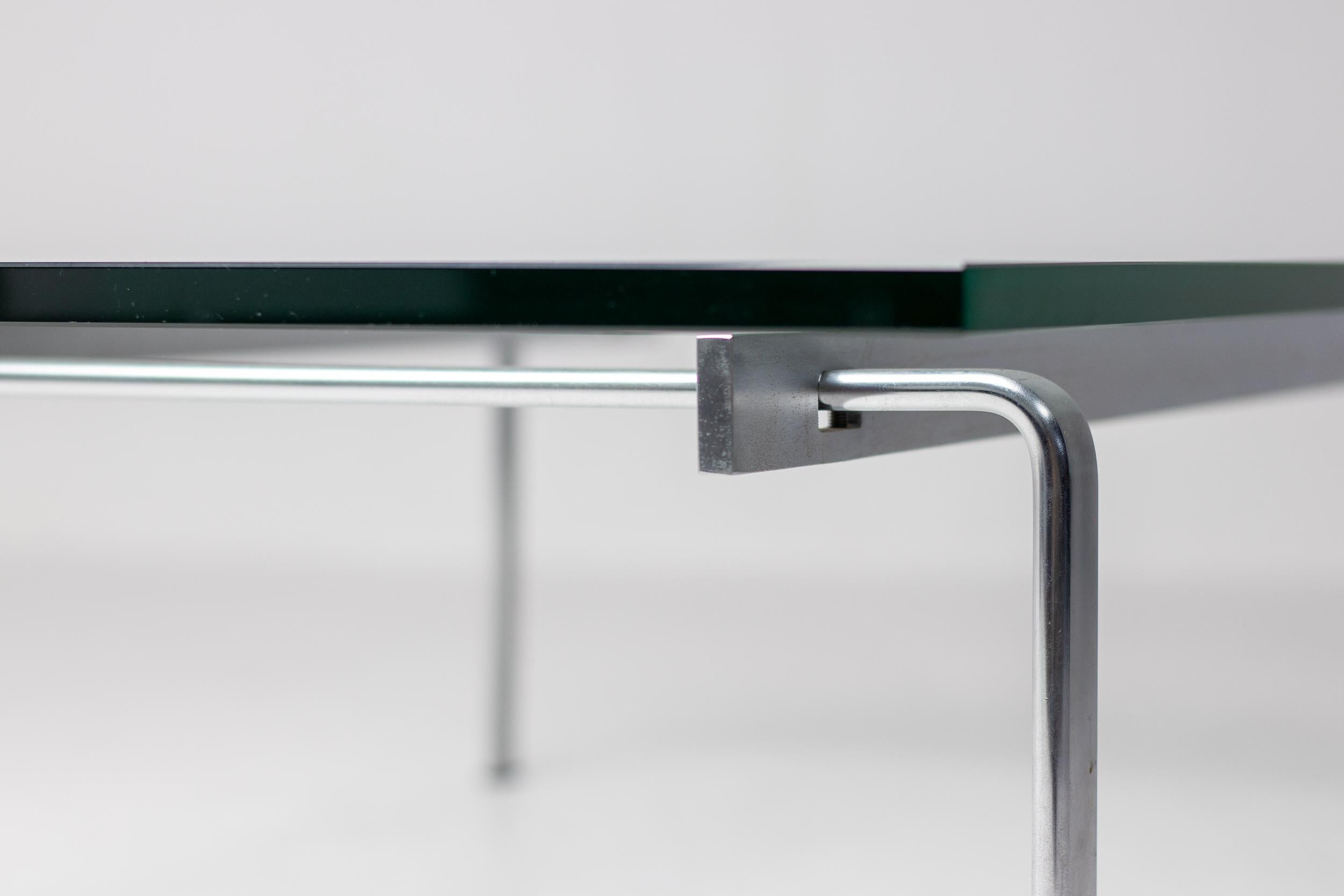 Glass coffee table designed by Preben Fabricius and Jørgen Kastholm in 1973 and produced by the Alfred Kill International, Germany, circa 1970. Model FK90. The coffee table is made with a chrome-plated steel frame and a strong safety glass top. The