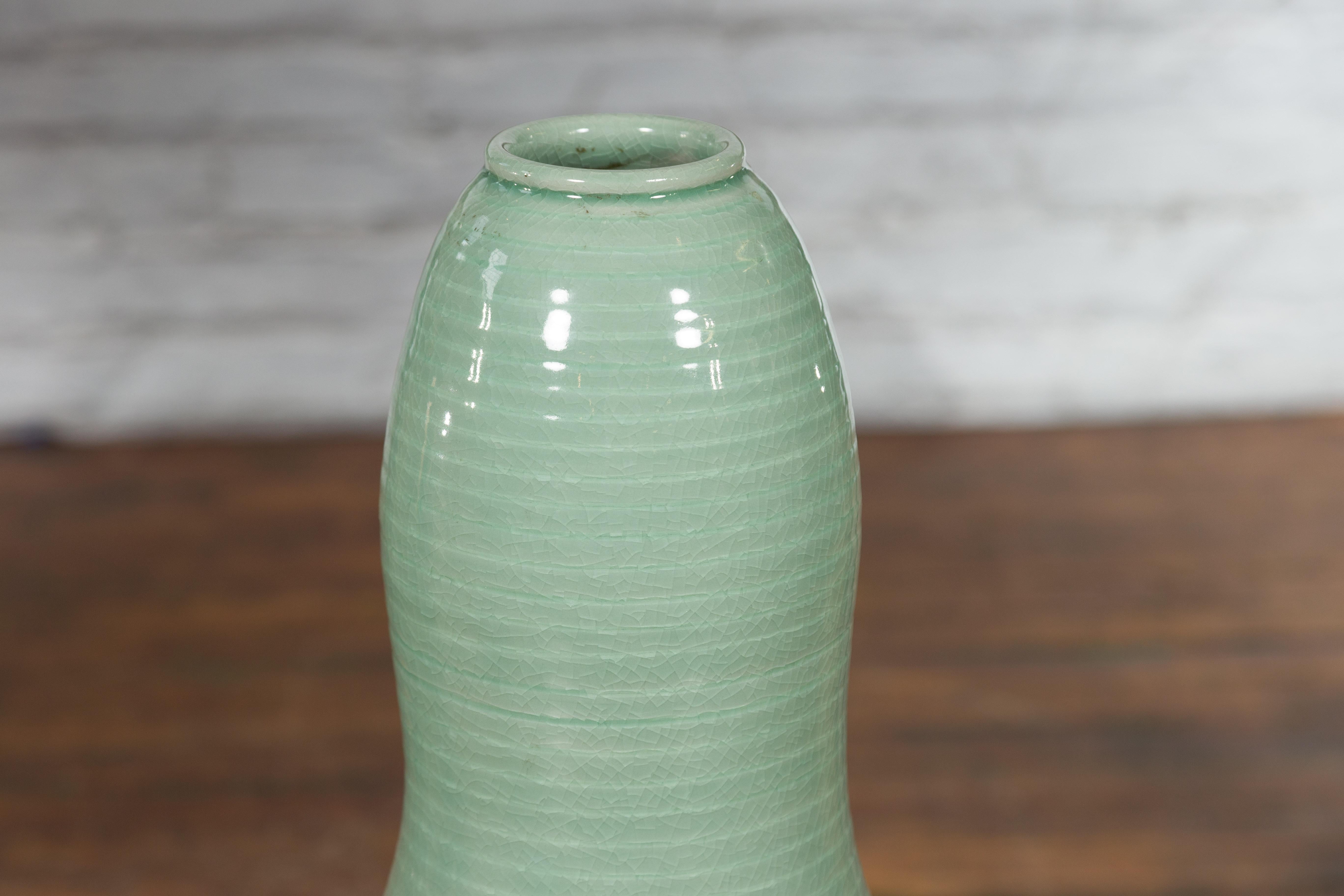 Smaltato Tall Gourd Shaped Vase with Soft Green Glaze and Sculptural Silhouette in vendita