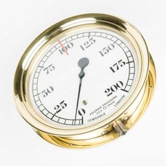 Large pressure gauge with brass bezel by Dewrance of London