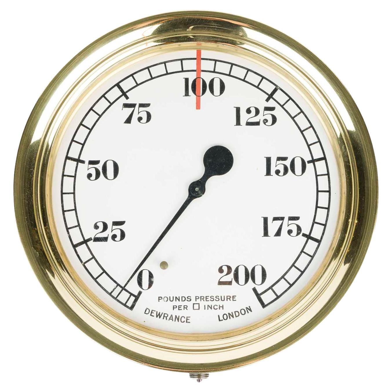 Large pressure gauge with brass bezel by Dewrance of London