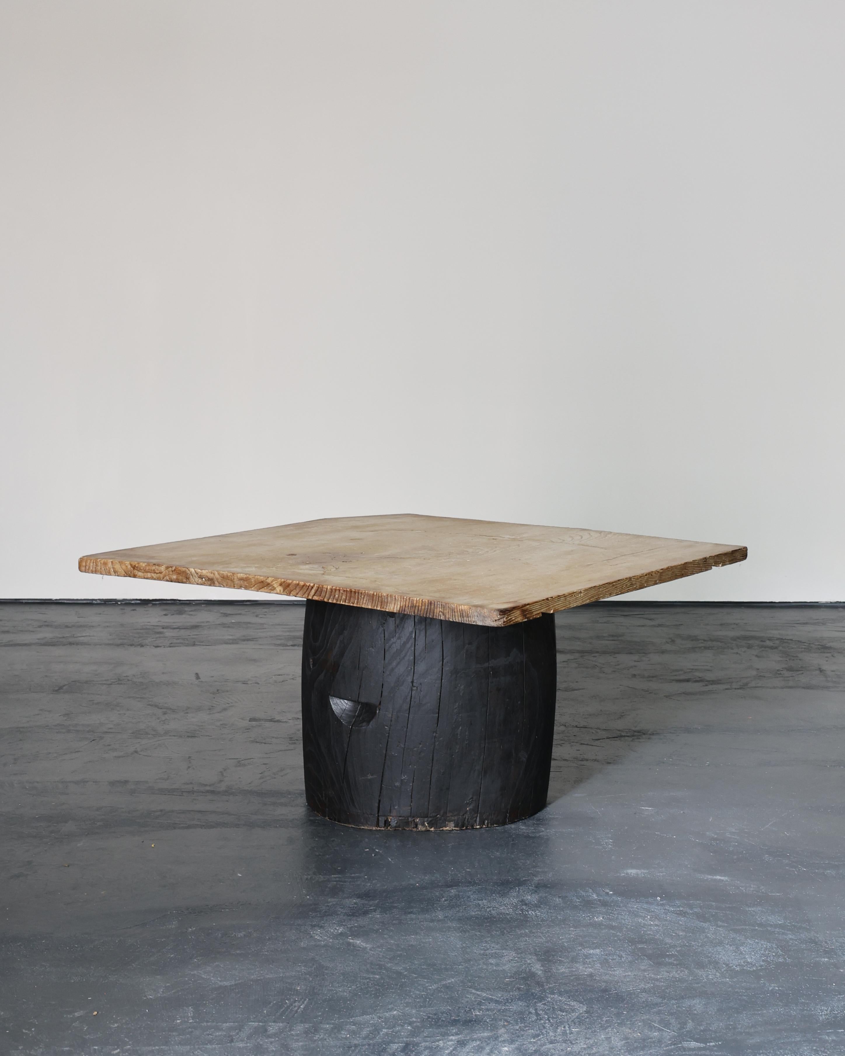 A unique, large dug-out Japanese coffee table. Heavily patinated bleach out cedar top on heavily patinated charred dug-out cedar base. Made using 19th C. Japanese elements in our London workshop.

W99cm x D99cm x H53cm