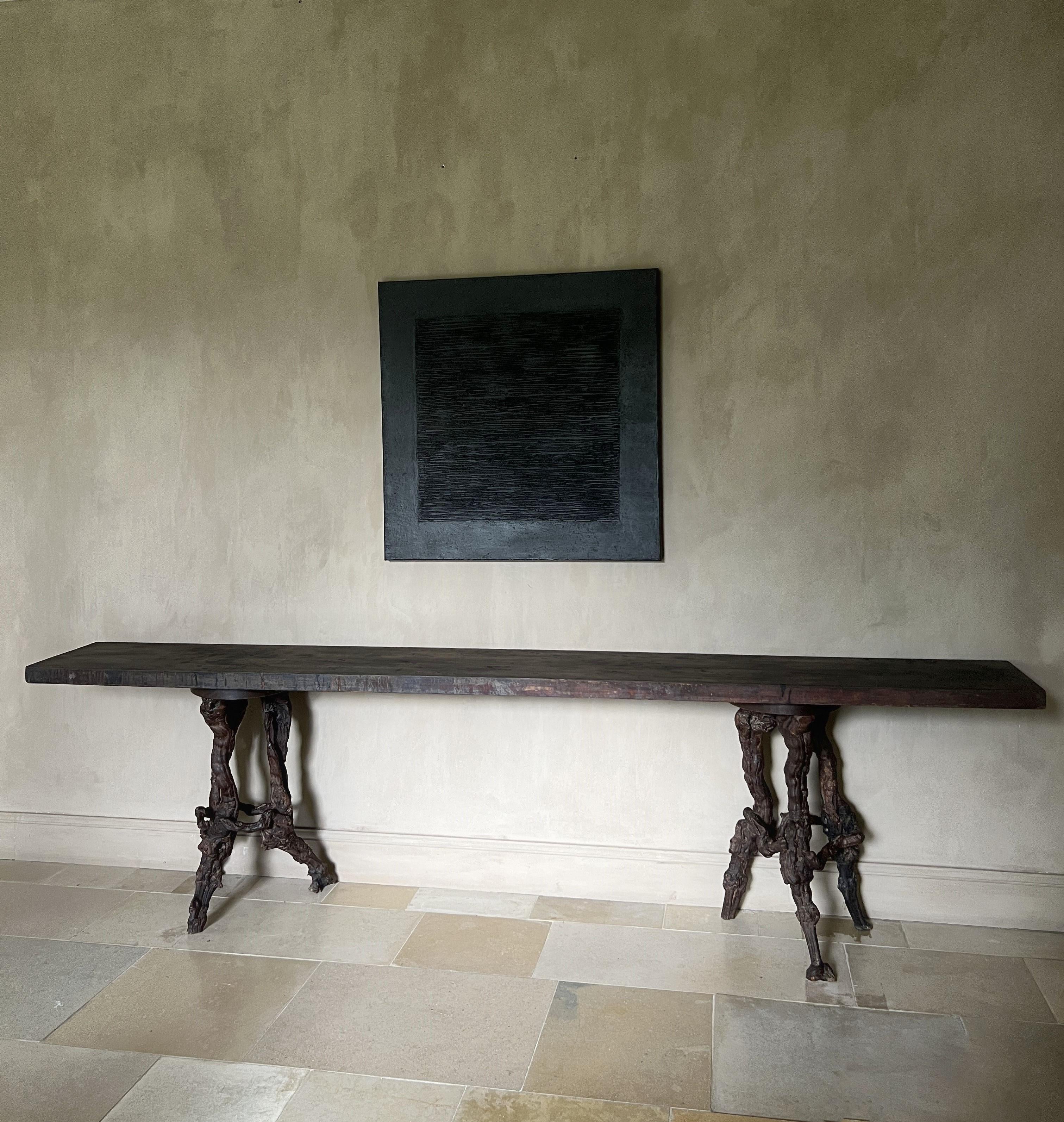 As we have a large stock and are always discovering new treasures sometimes we find matches made in heaven. As for example this 19th century Asian one slab elm top fitted perfectly on a pair of early winerank supports. The top probably started out