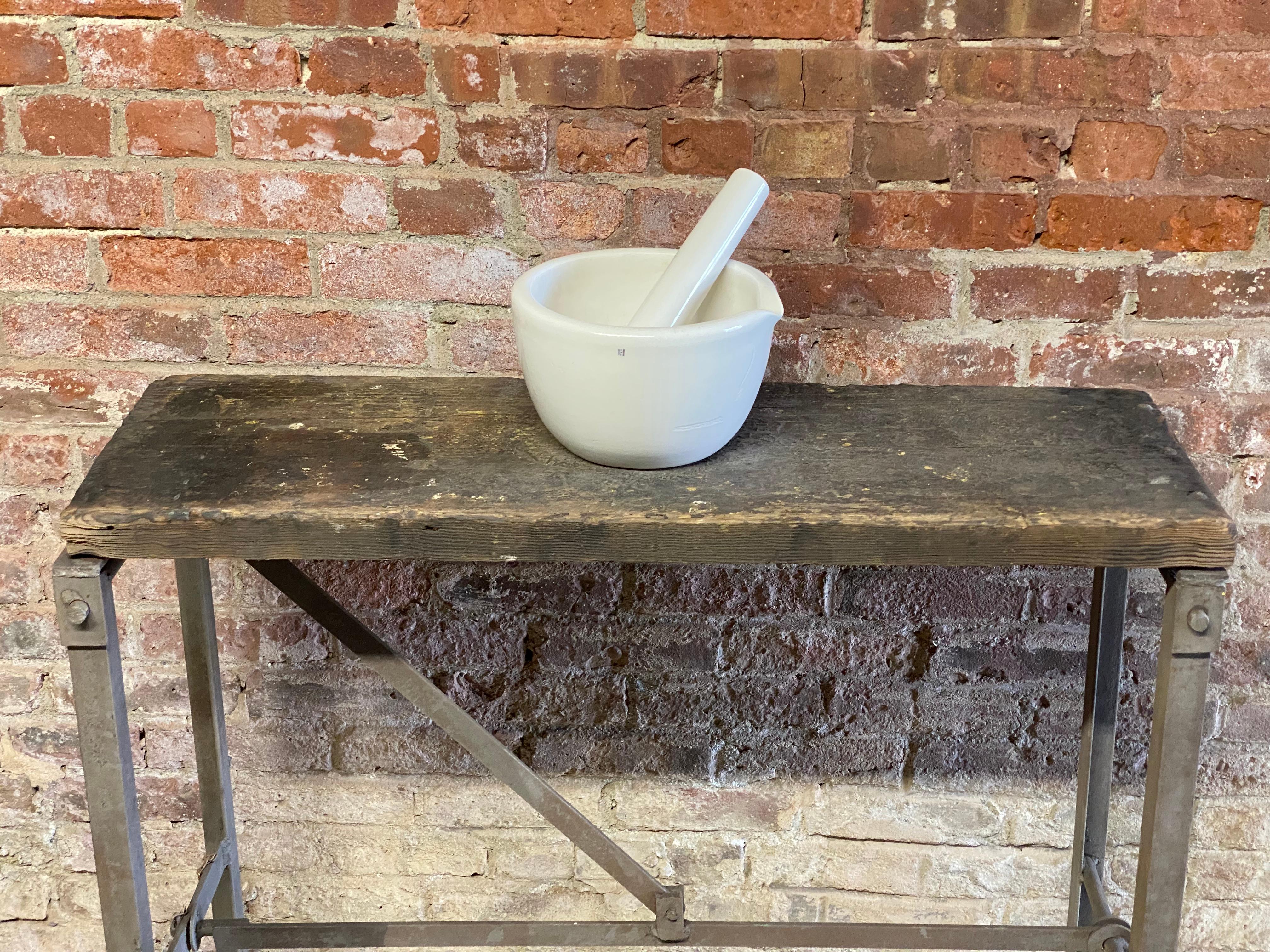 Large Coors Prohibition Era porcelain mortar and pestle. A larger example that looks fantastic anywhere in the home, especially the kitchen. Wonderful scale. Signed on both mortar and pestle in cobalt blue. Glossy white glazed exterior and unglazed