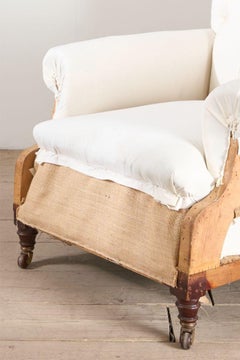 Large proportioned 19th century buttoned back armchair by Hamptons and sons