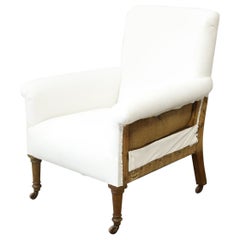Large proportioned Edwardian armchair on tall legs