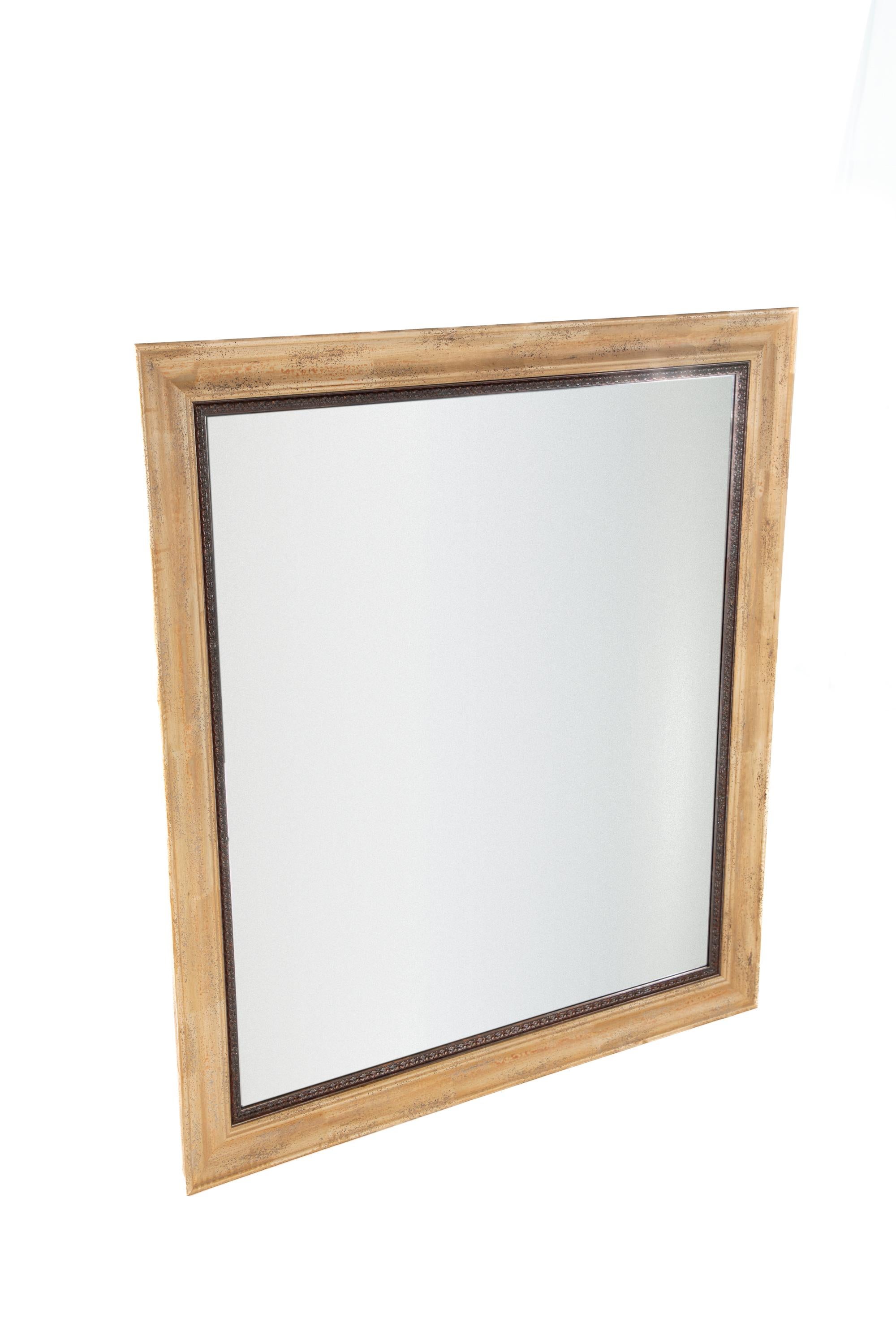 Large provincial-style wood framed wall mirror with distressing
