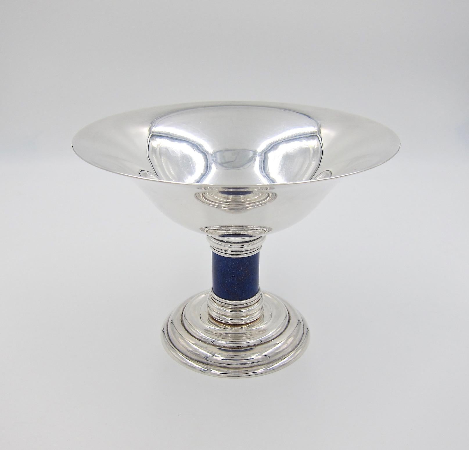 A large and elegant Art Deco compote designed by Jean E. Puiforcat (1897-1945) in the 1930s for renowned silversmiths Puiforcat of Paris; the firm produced the form for several decades during the 20th century. The piece resembles an oversized