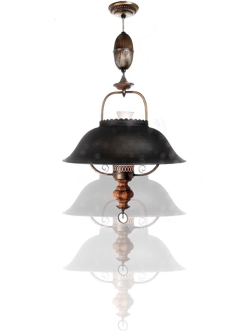 This is a large lantern style chandelier. It features a deep 20 inch diameter shade, milk glass chimney and some unique decorative wood details. The pull down mechanism has a coil spring that holds and rolls the wire. The lamp can travel from a drop