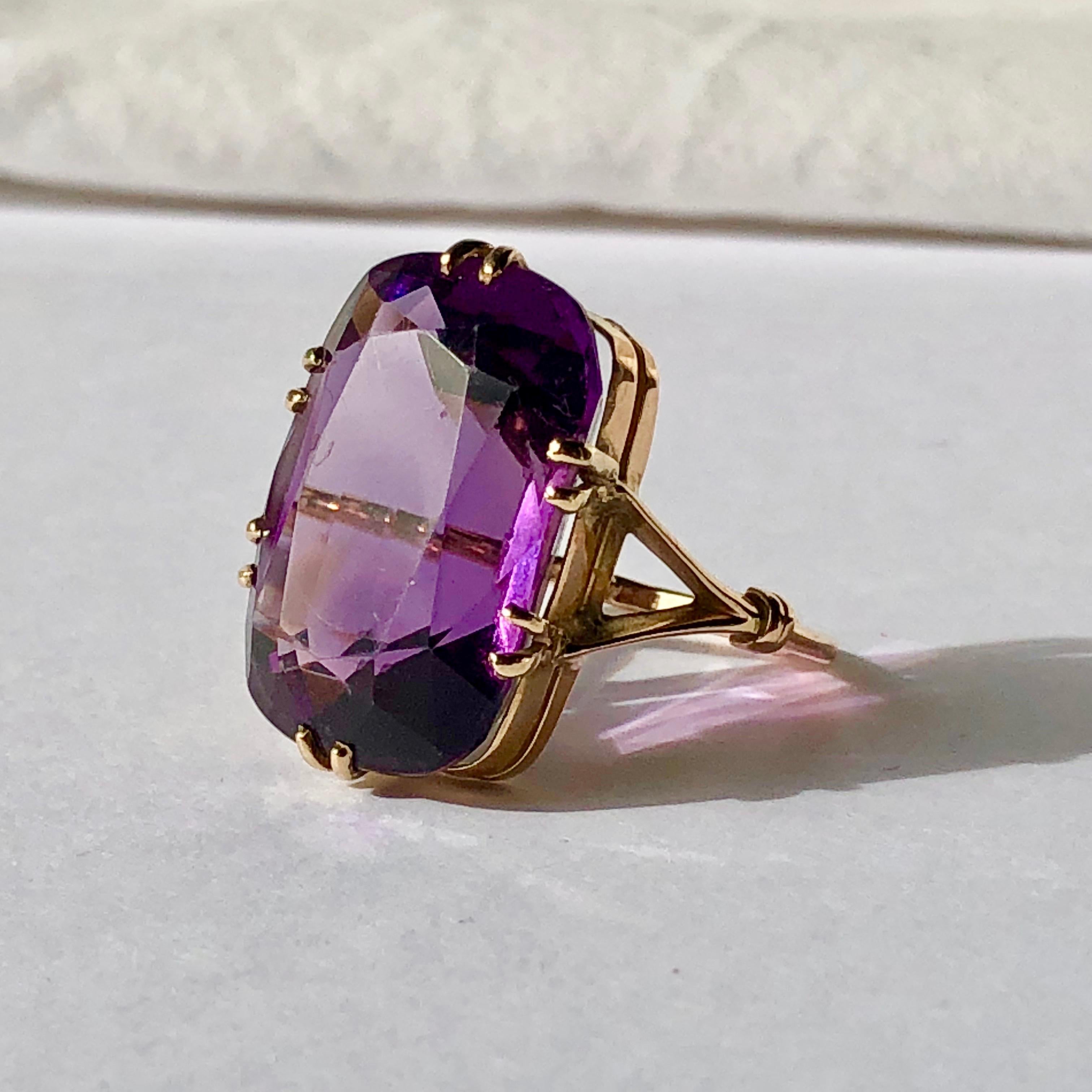 A fabulous large amethyst ring on yellow gold

Set with 6 attractive double claws which not only keep the stone safe and secure but are a real design feature

The Bifurcated yellow gold shank with design 'bands' to each fork in the shoulder further