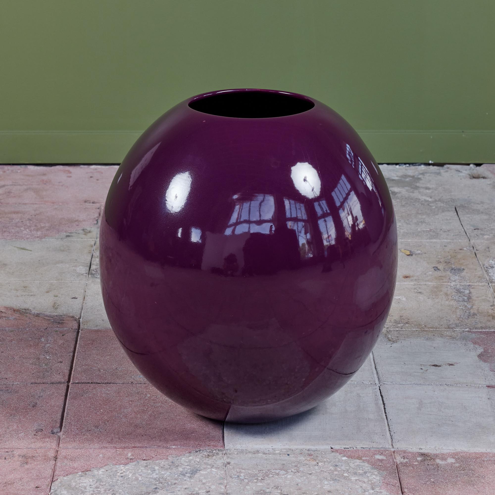 Fabulously large, rounded glazed planter in 'Eggplant' by ceramics artist Marilyn Kay Austin for Architectural Pottery. This example, called the floor vase or egg planter, has an almost spherical design with a small 9.25